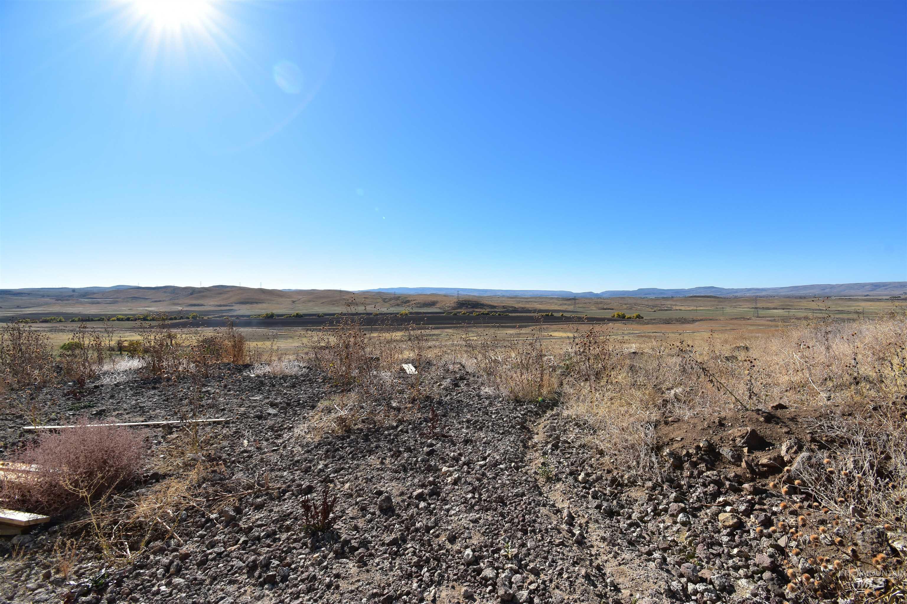 View of yard with a mountain view and a view of rural / pastoral area