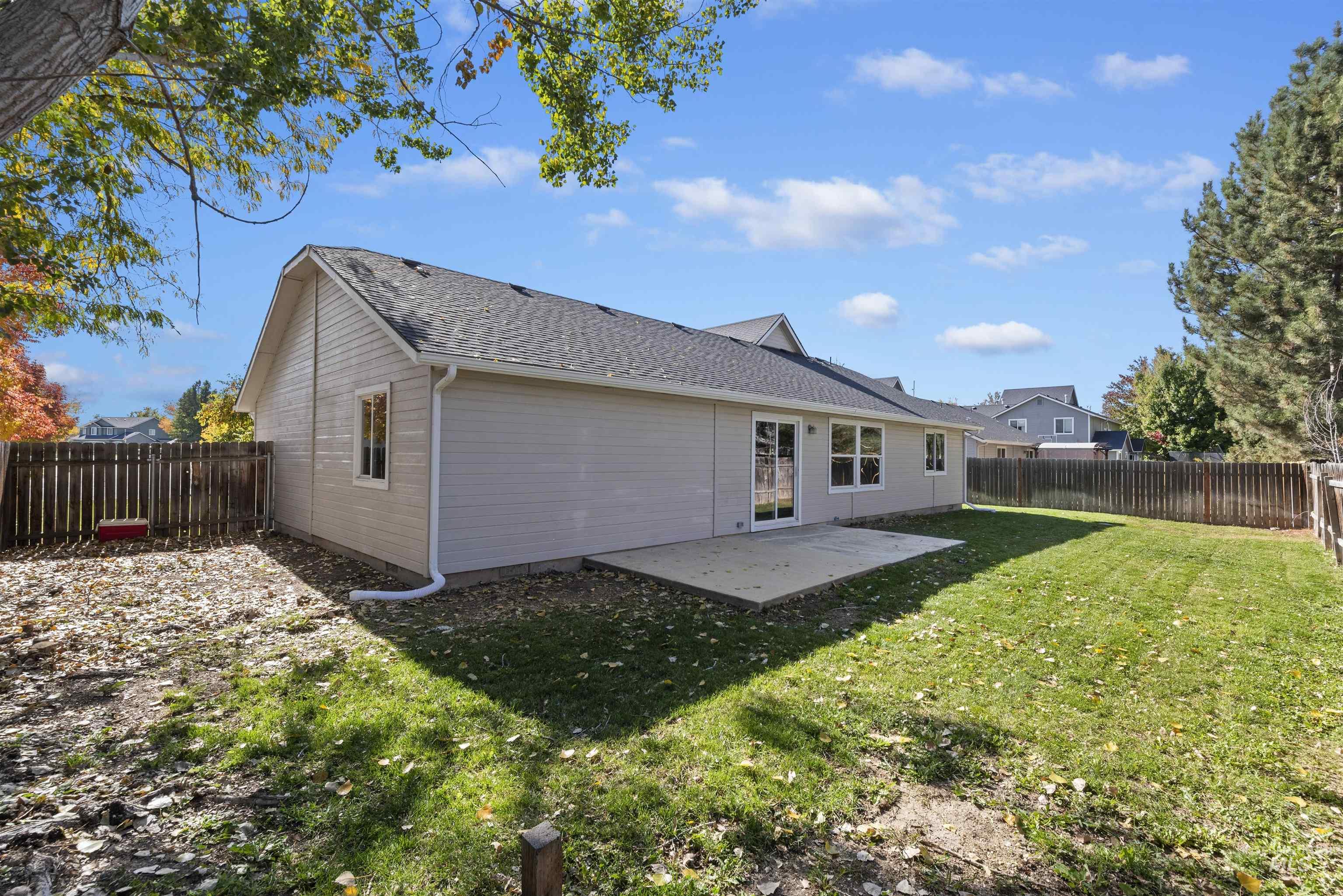 Back of house with a patio area and a fenced backyard