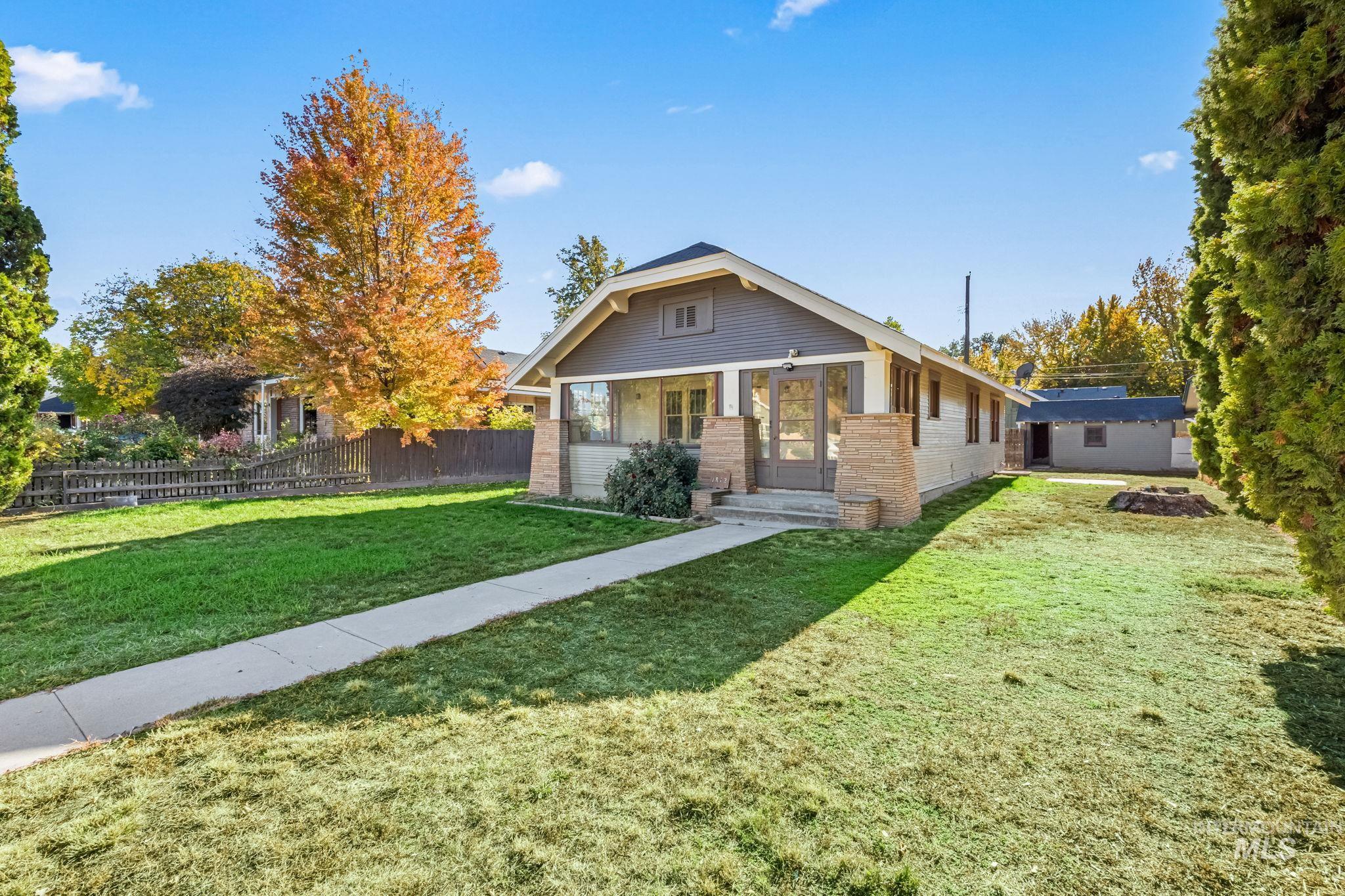 View of front of property featuring brick siding and covered porch