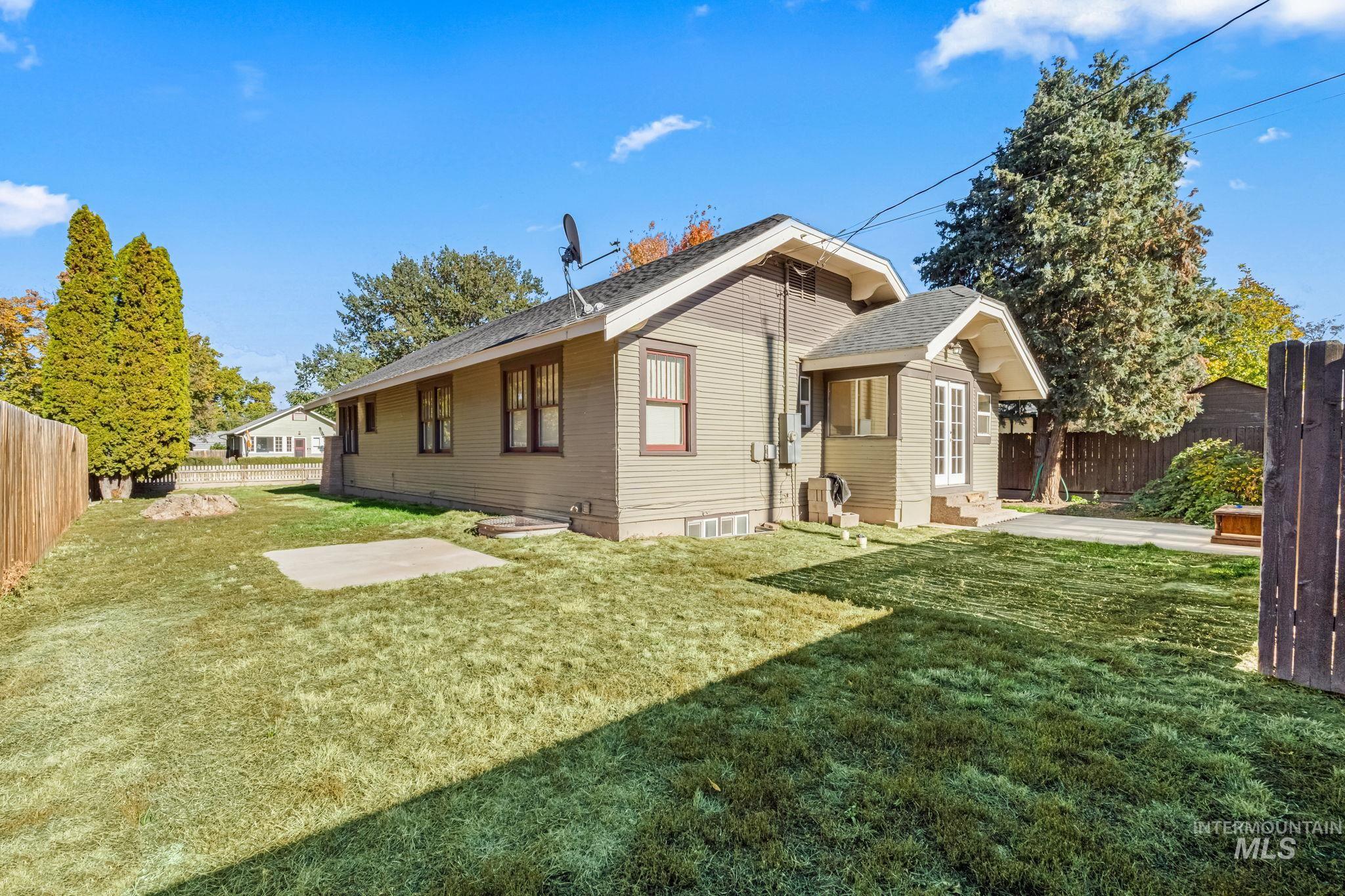 Rear view of house with roof with shingles