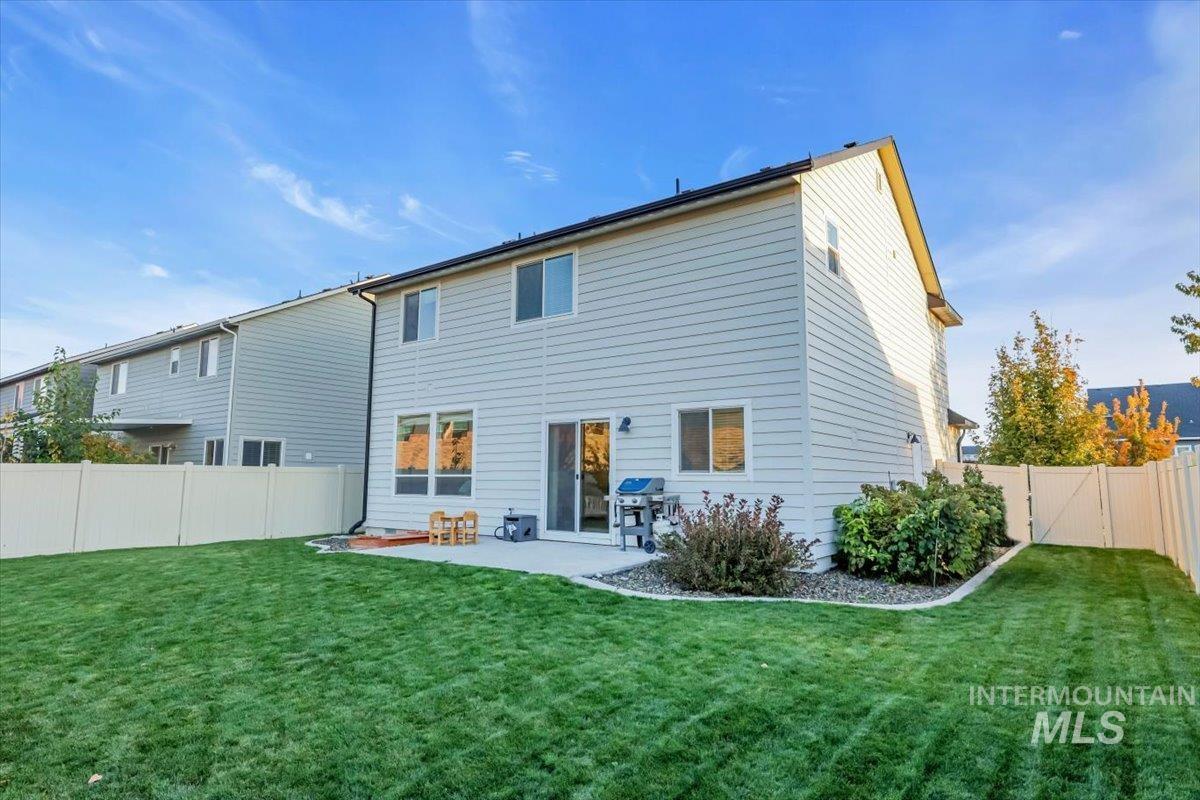 Back of house featuring a patio and a fenced backyard