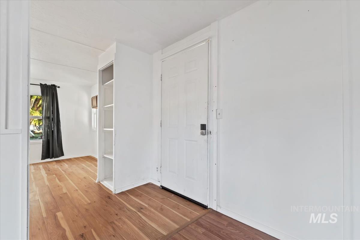 Entryway with light wood-style floors