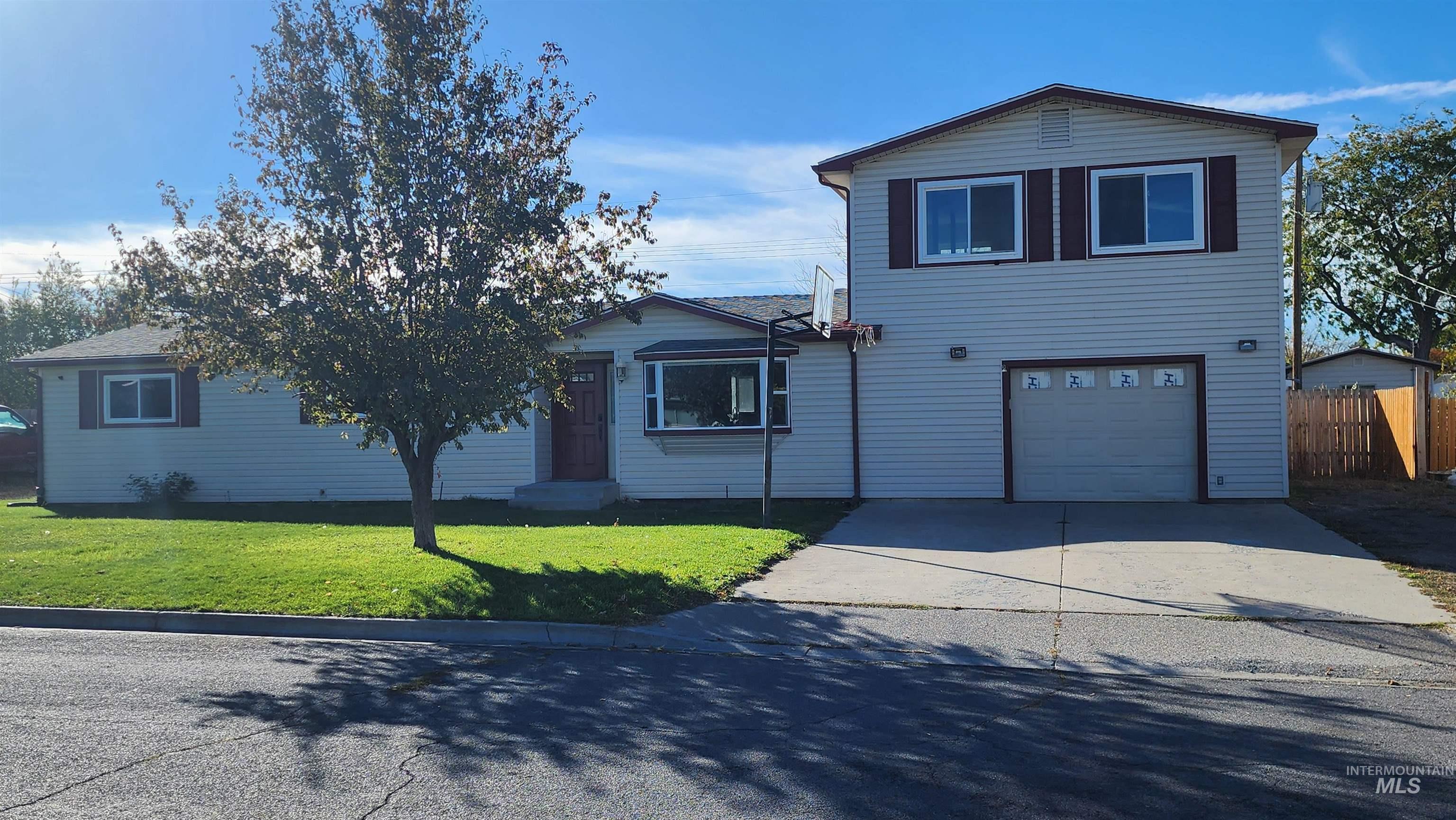 Traditional-style home with a garage and concrete driveway