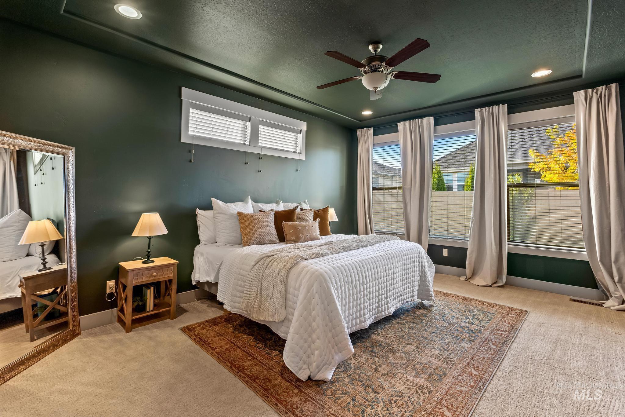 Bedroom featuring carpet floors, a ceiling fan, recessed lighting, and a textured ceiling