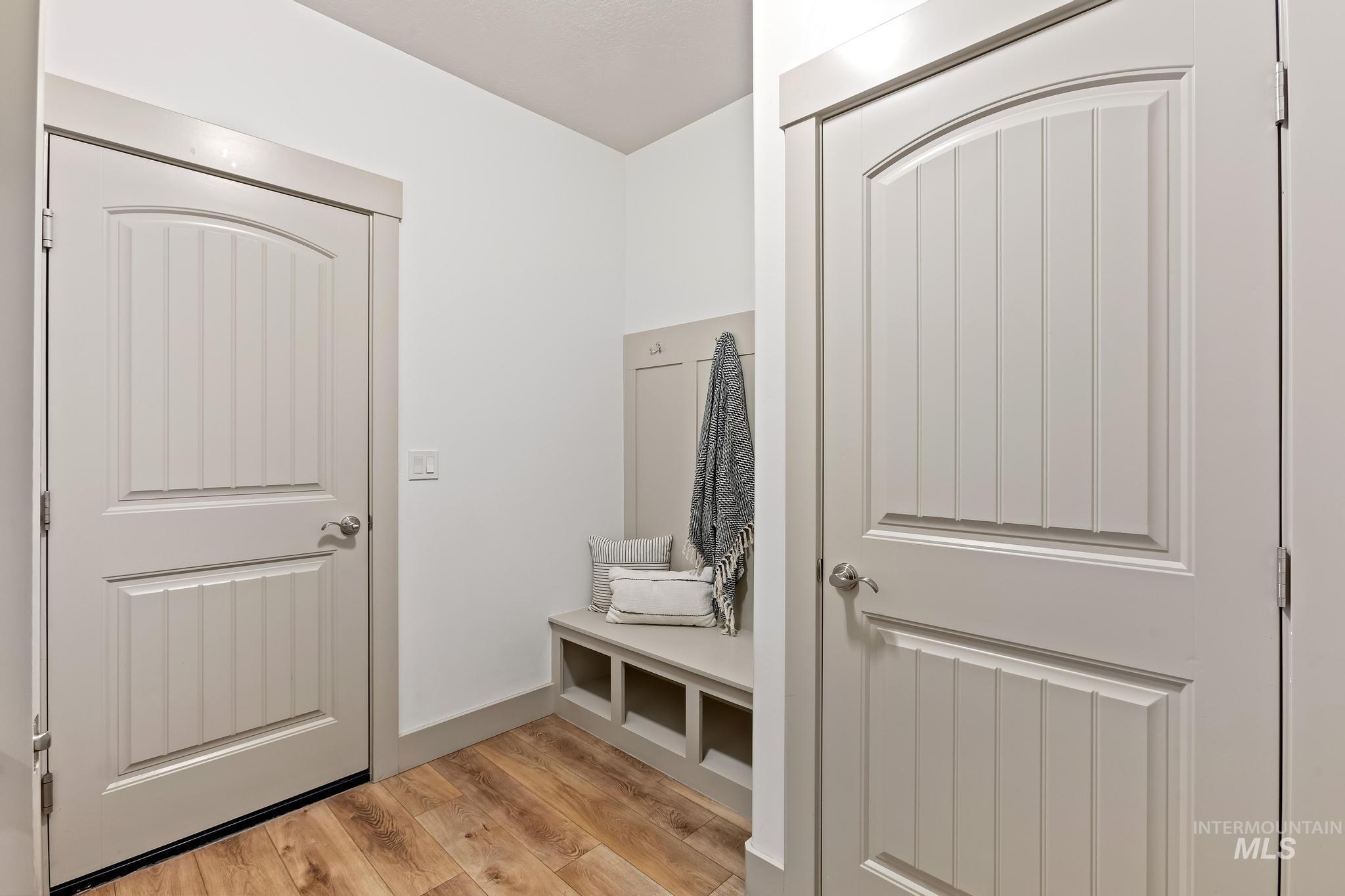 Mudroom with light wood finished floors