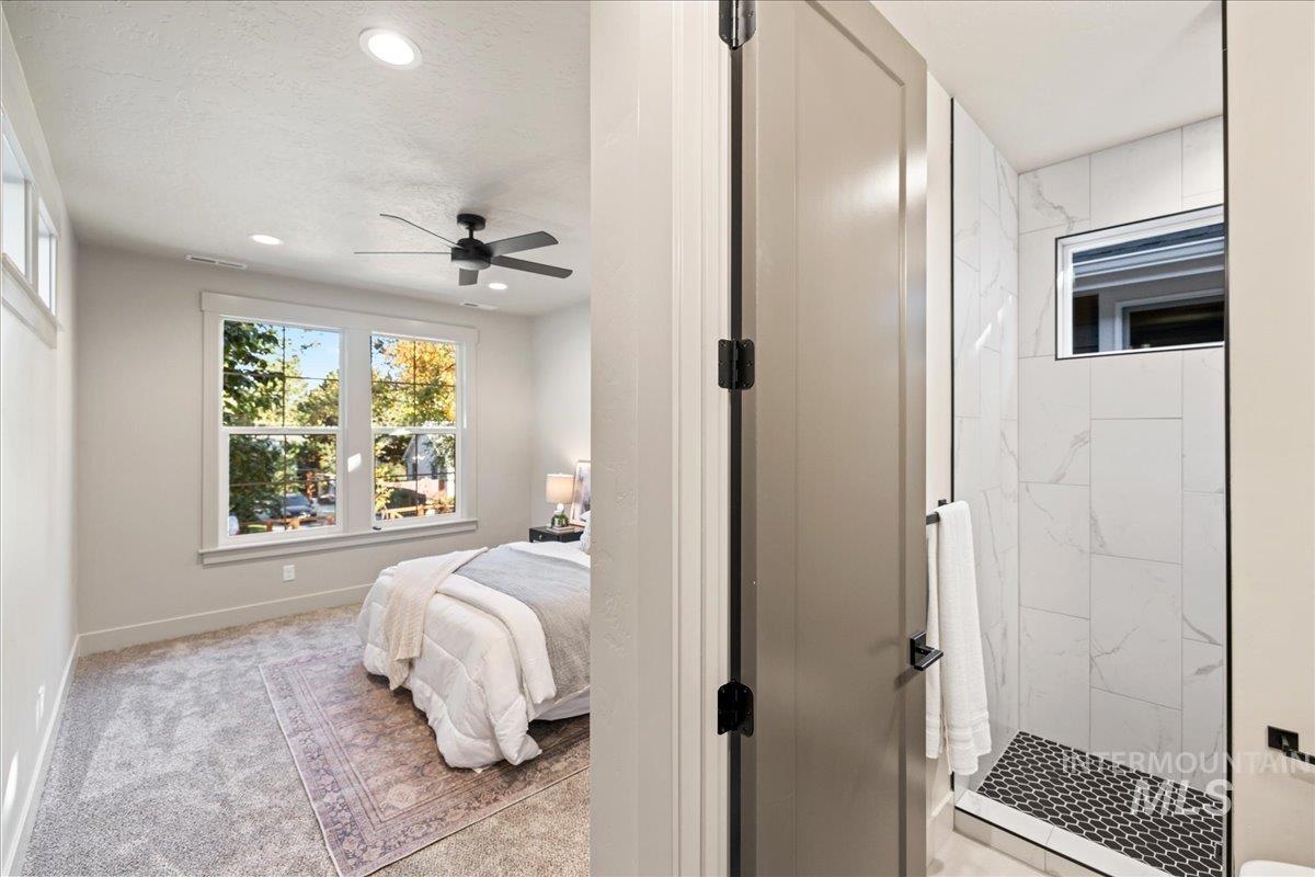 Bedroom featuring light colored carpet, recessed lighting, and ceiling fan