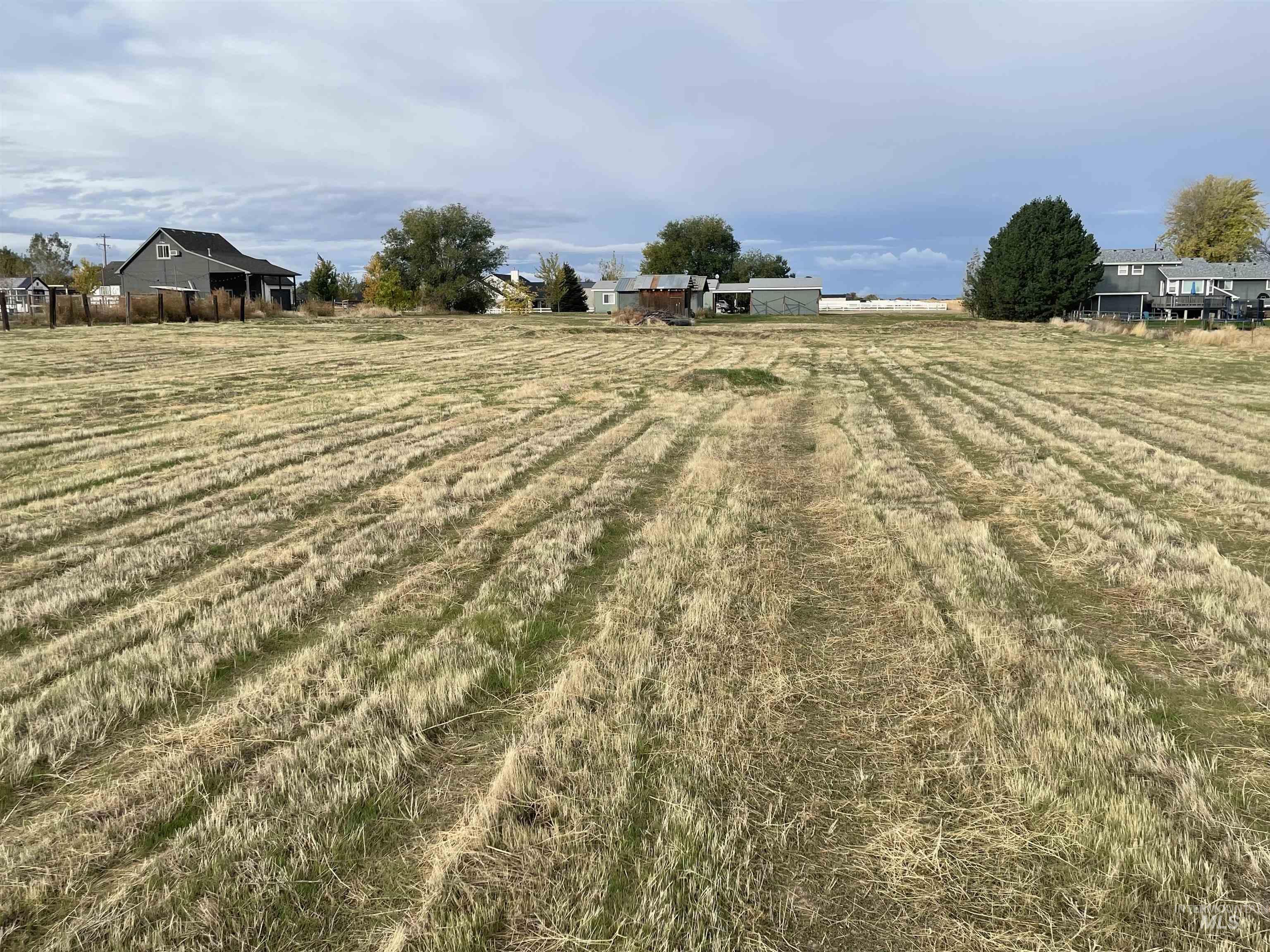 View of grassy yard featuring a rural view and agricultural area