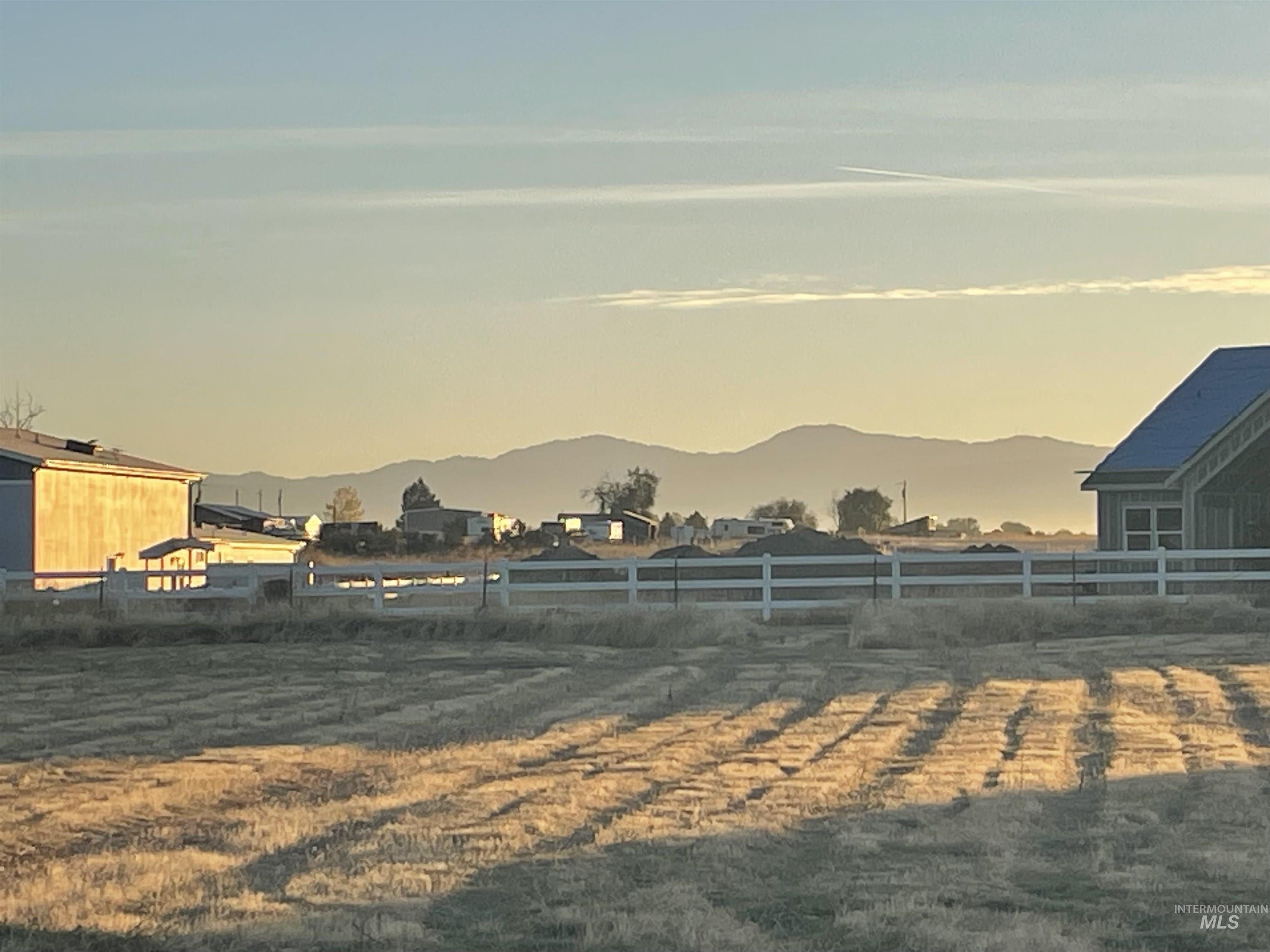 Yard at dusk featuring a mountain view