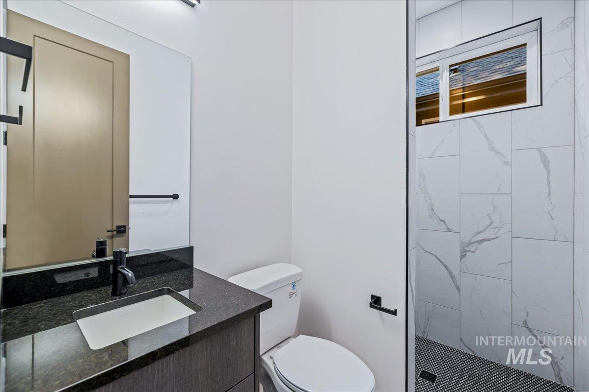 Bathroom with vanity and a stall shower