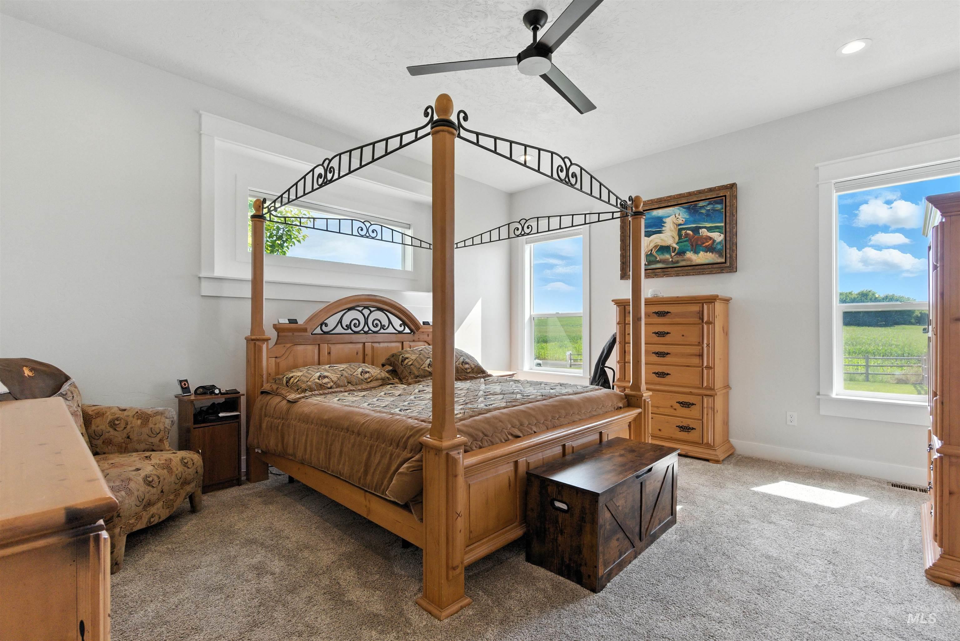 Bedroom featuring carpet flooring and ceiling fan