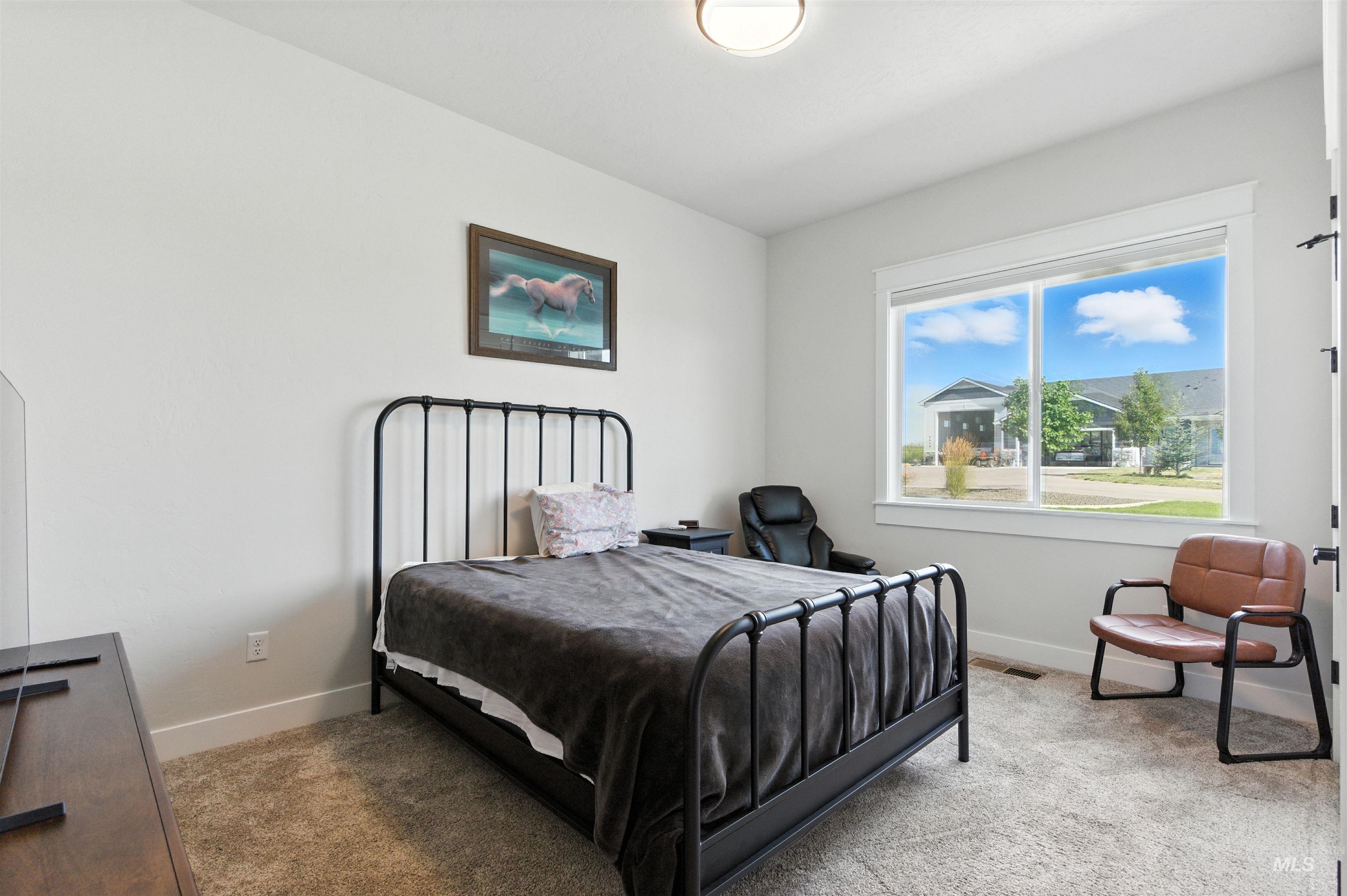 Bedroom featuring carpet floors