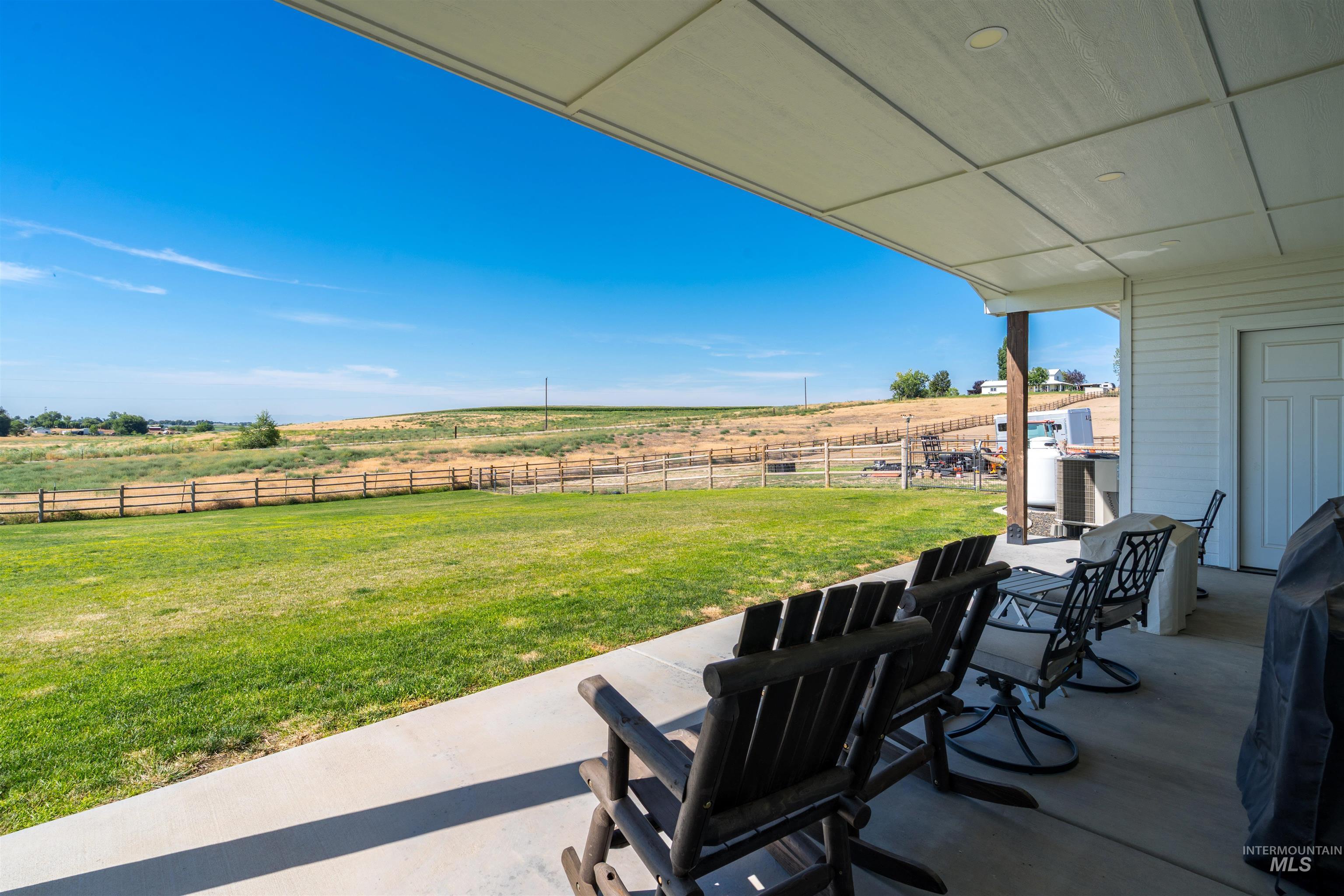 View of patio featuring a view of countryside and grilling area