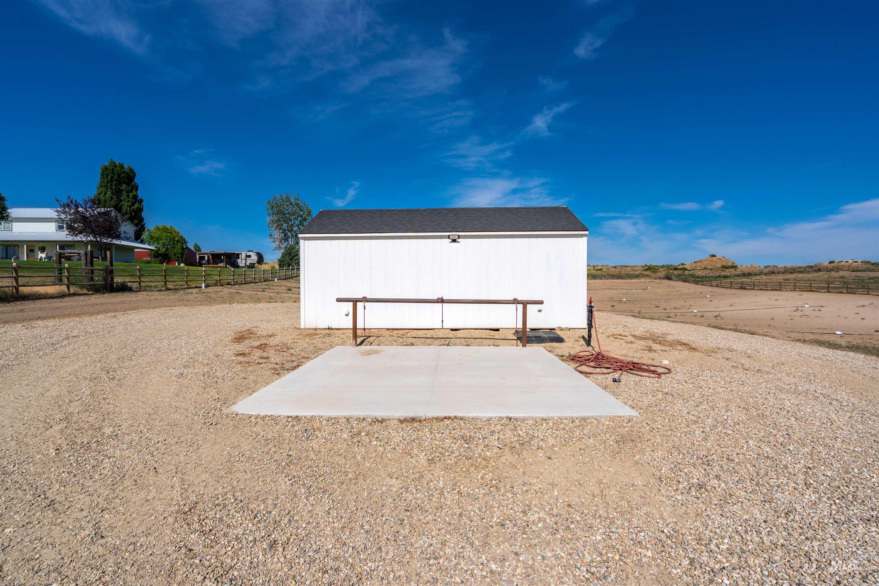 View of outbuilding with a rural view