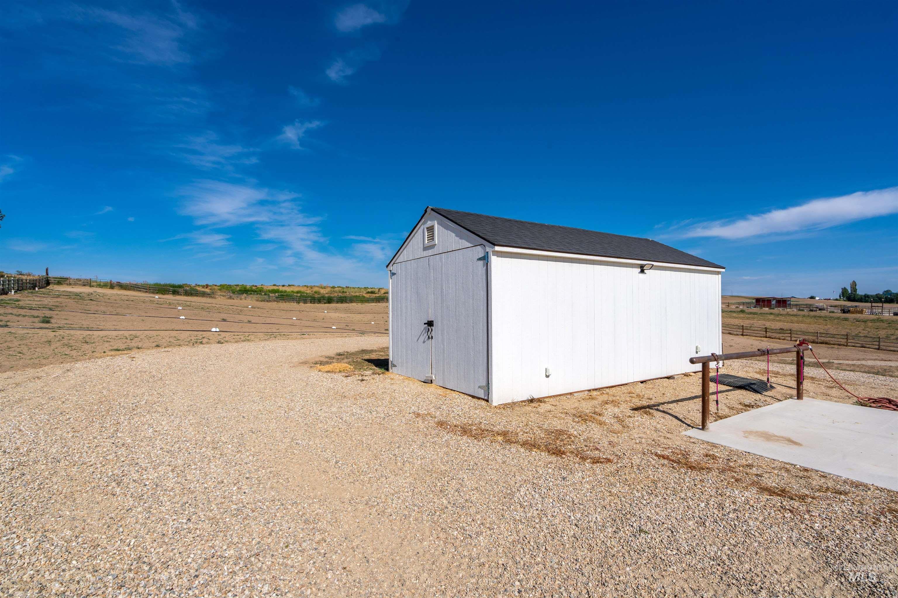 View of outdoor structure featuring a rural view