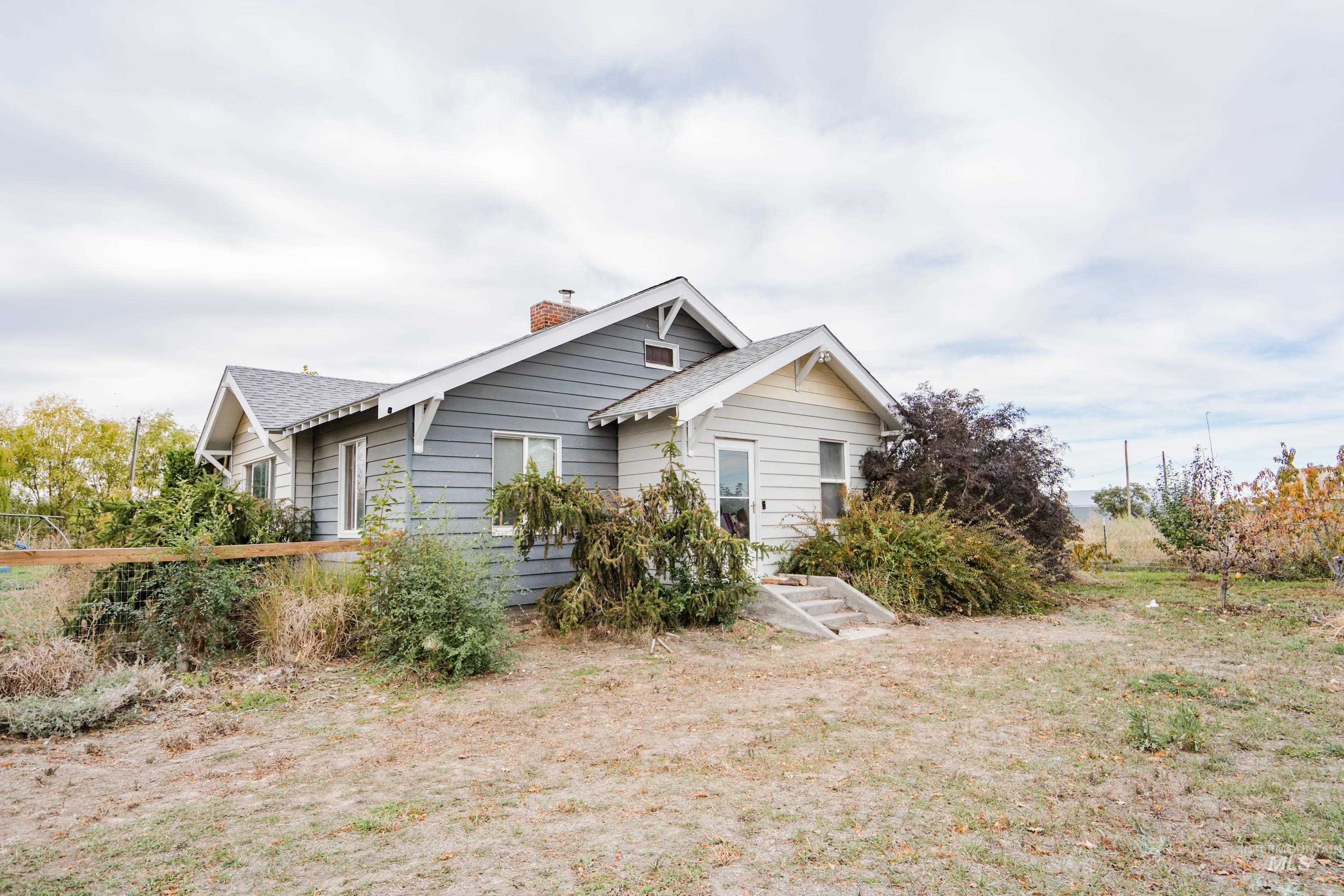 View of front of property with a chimney