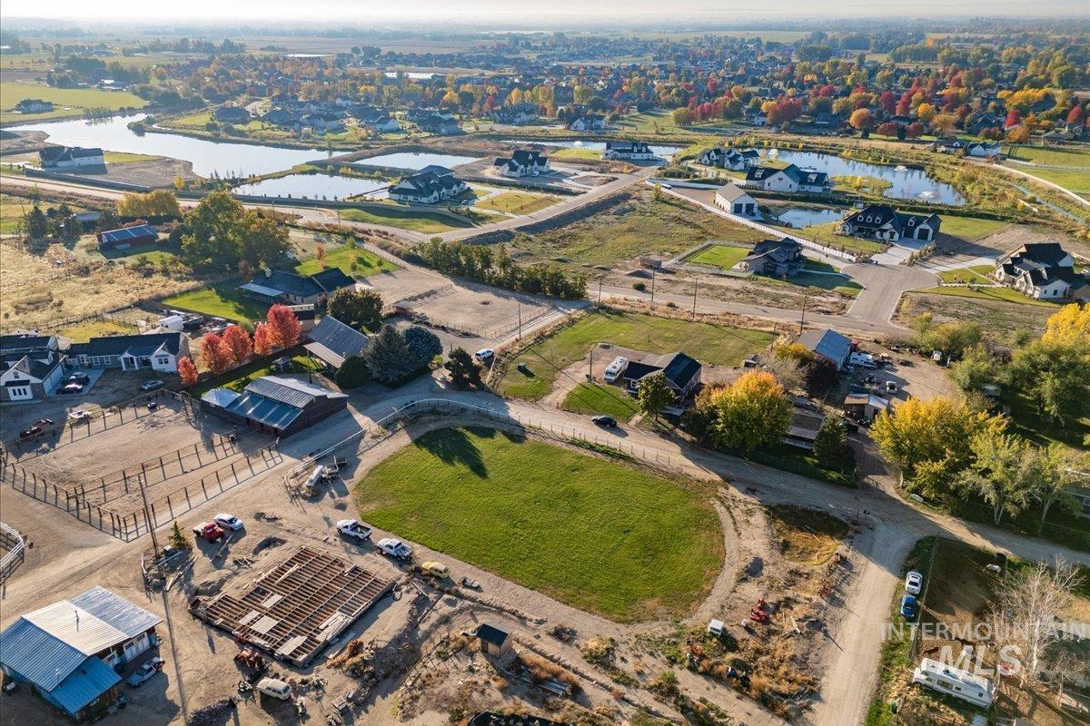 Aerial overview of property's location with a large body of water