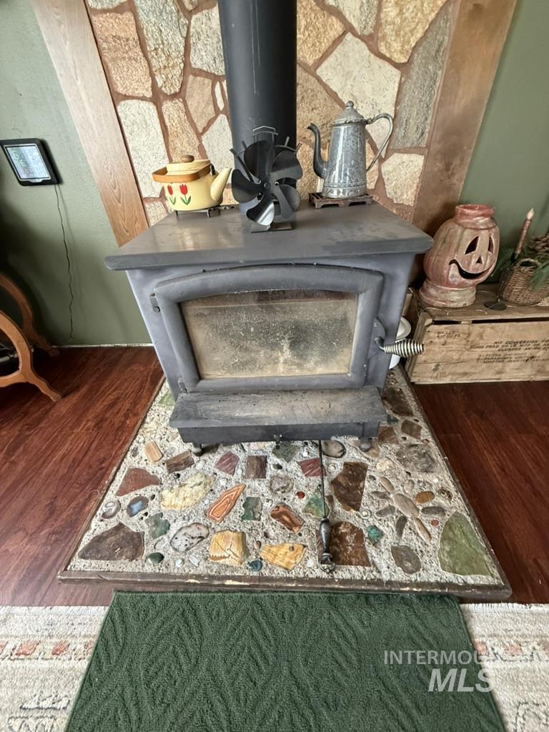 Detailed view of a wood stove and wood finished floors