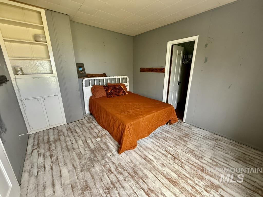 Bedroom with wood finished floors