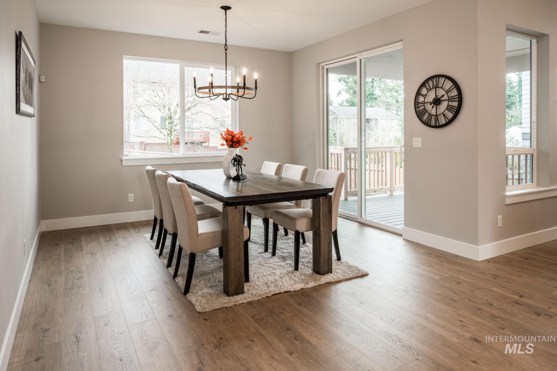 Dining room featuring hardwood / wood-style floors and a chandelier