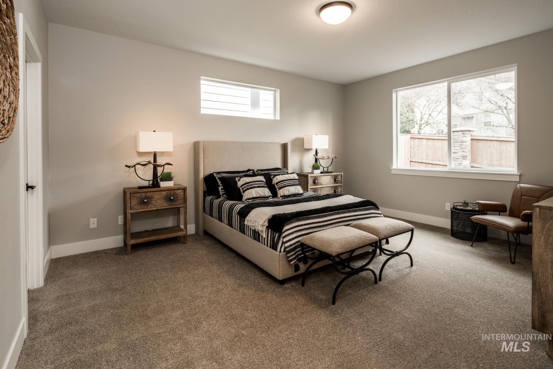 Carpeted bedroom with baseboards