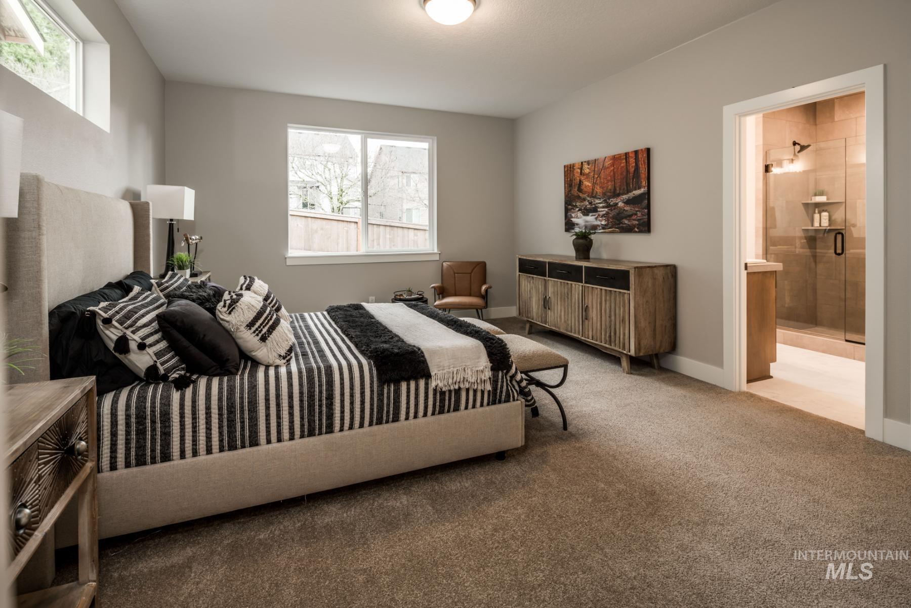 Bedroom with carpet and ensuite bathroom
