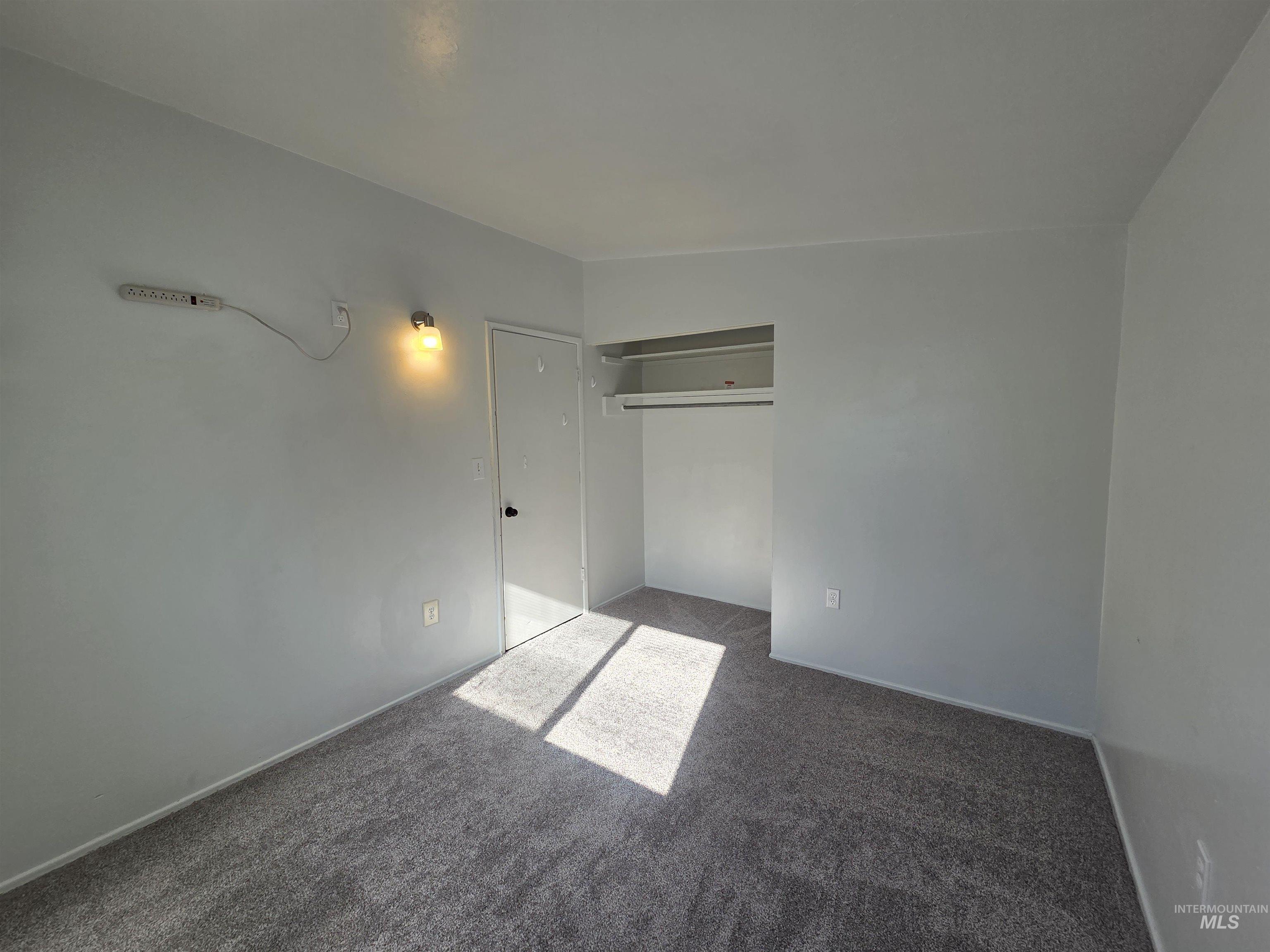 Unfurnished bedroom with carpet floors and a closet