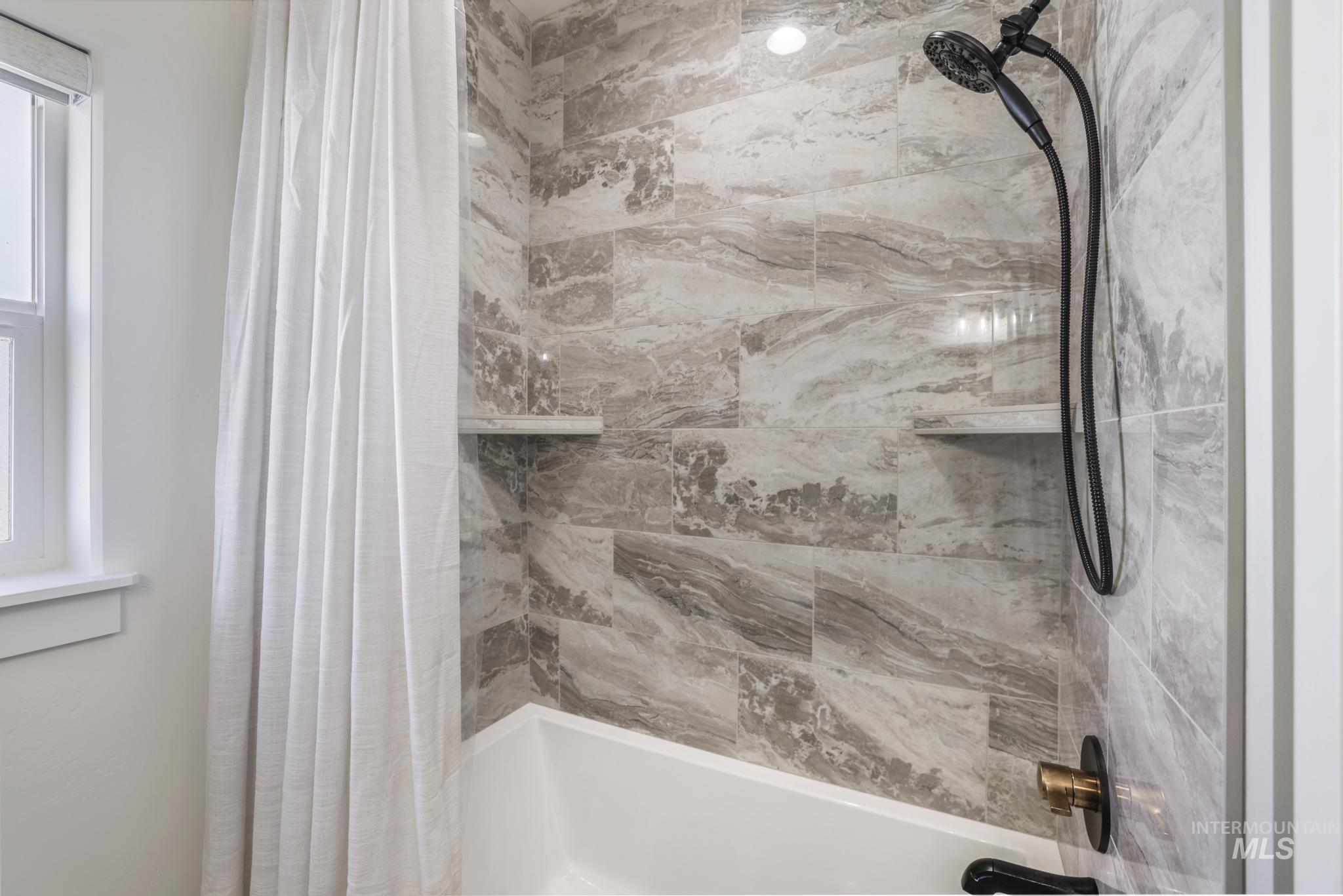 Full bathroom featuring shower / tub combo with curtain
