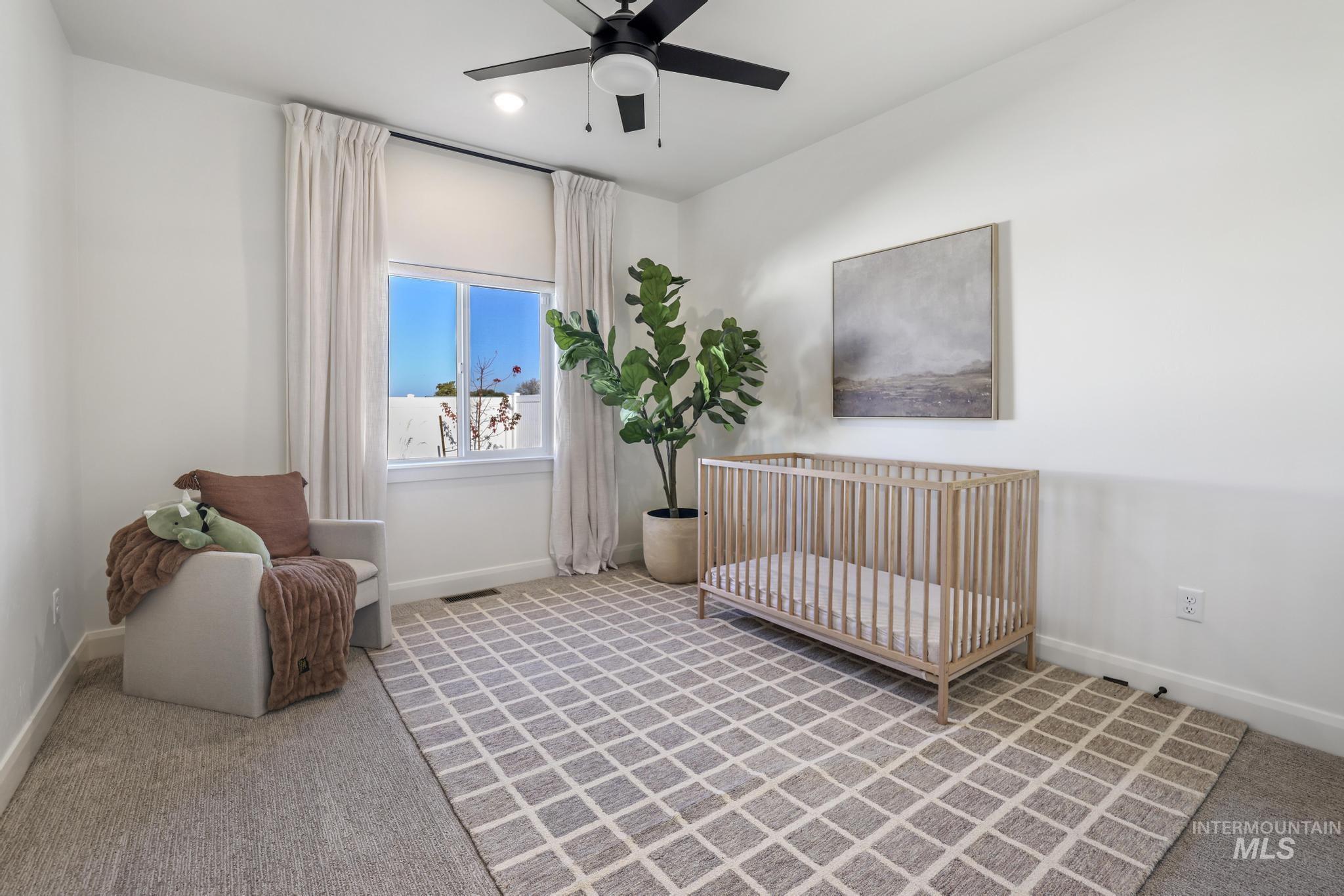Sitting room featuring light carpet, a ceiling fan, and recessed lighting
