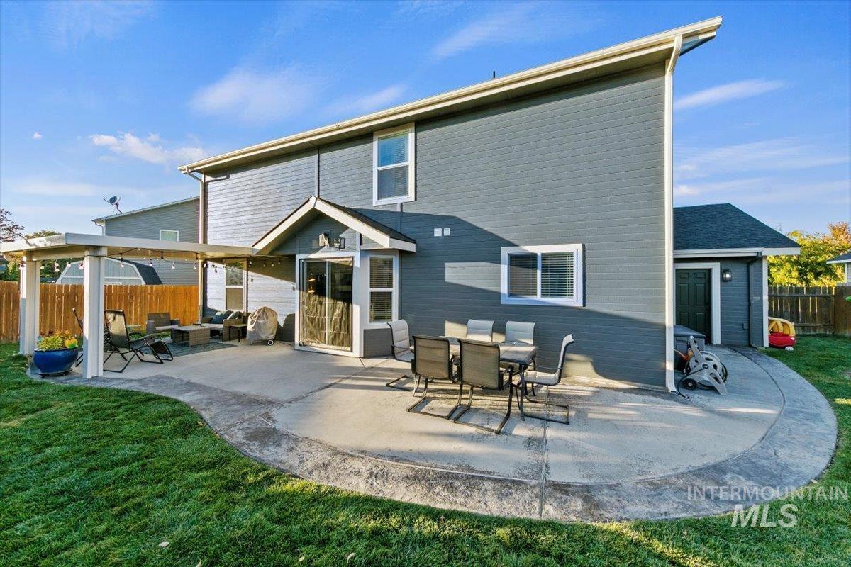 Back of house with a patio and an outdoor hangout area