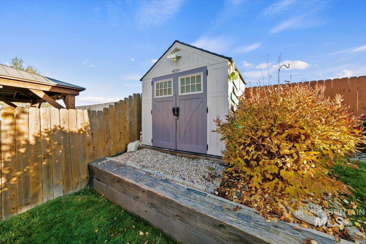 View of shed featuring a fenced backyard