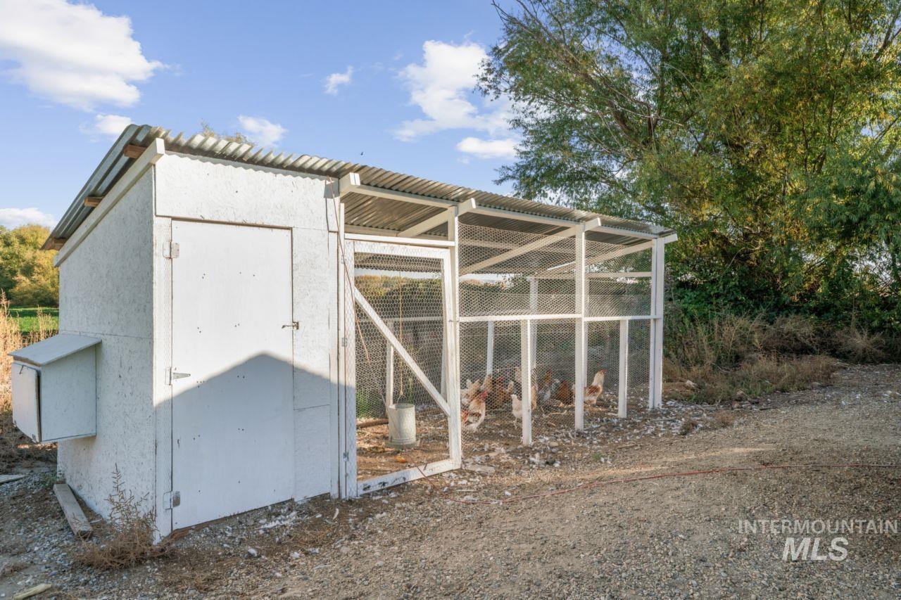 View of poultry coop featuring a sunroom