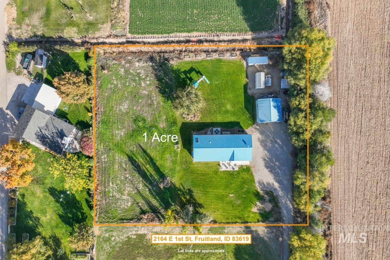 Aerial view of property and surrounding area with property parcel outlined