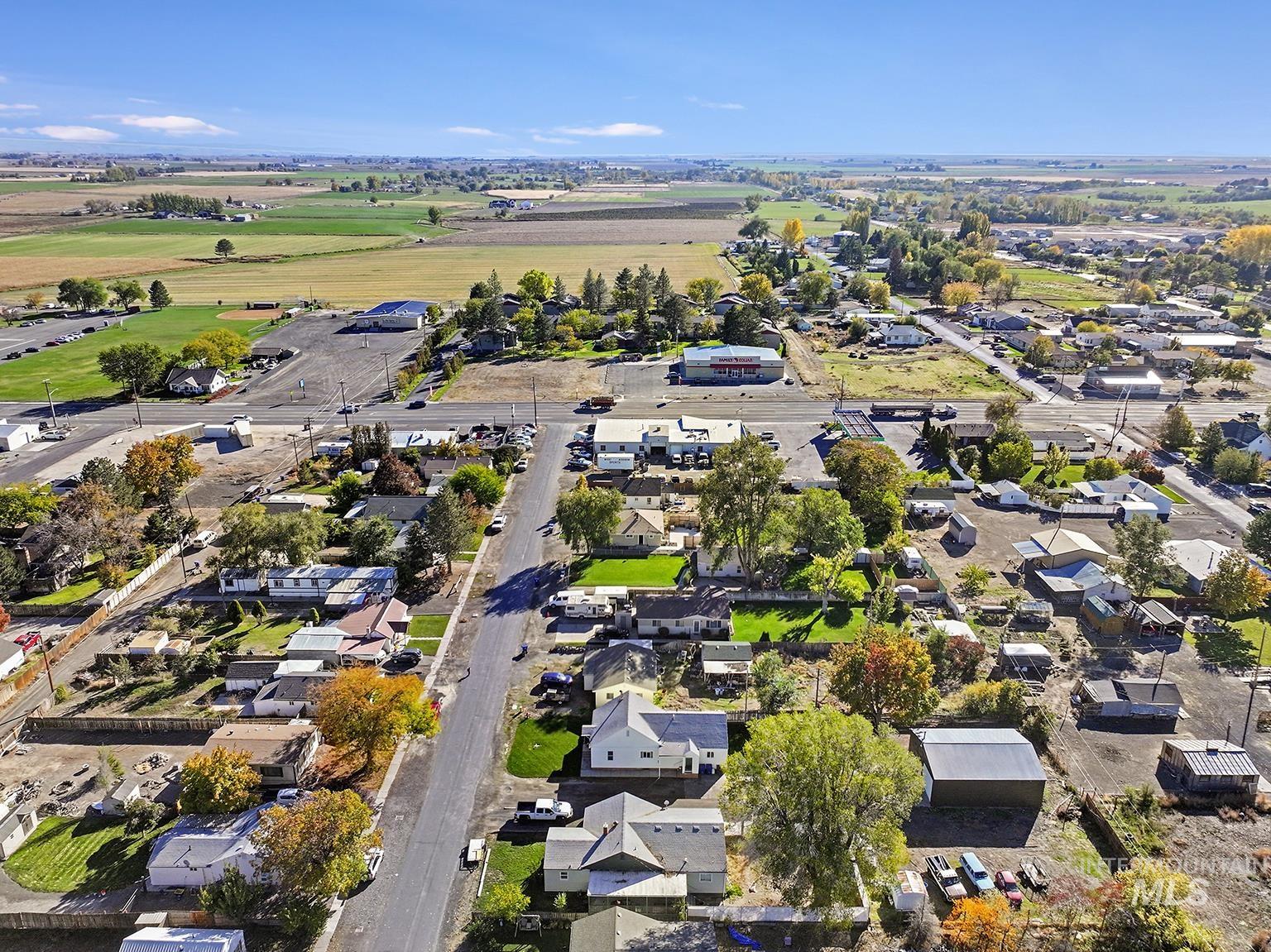 Aerial overview of property's location with nearby suburban area