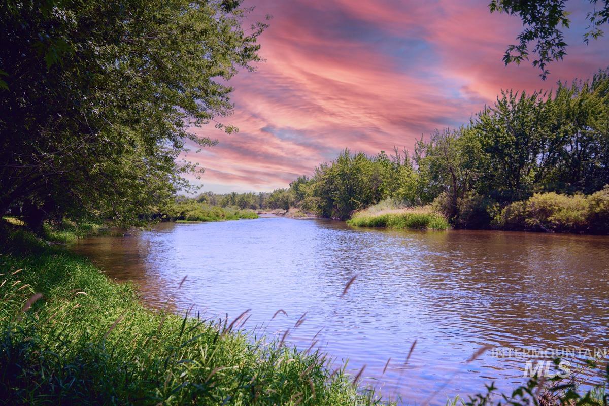 Water view featuring a heavily wooded area
