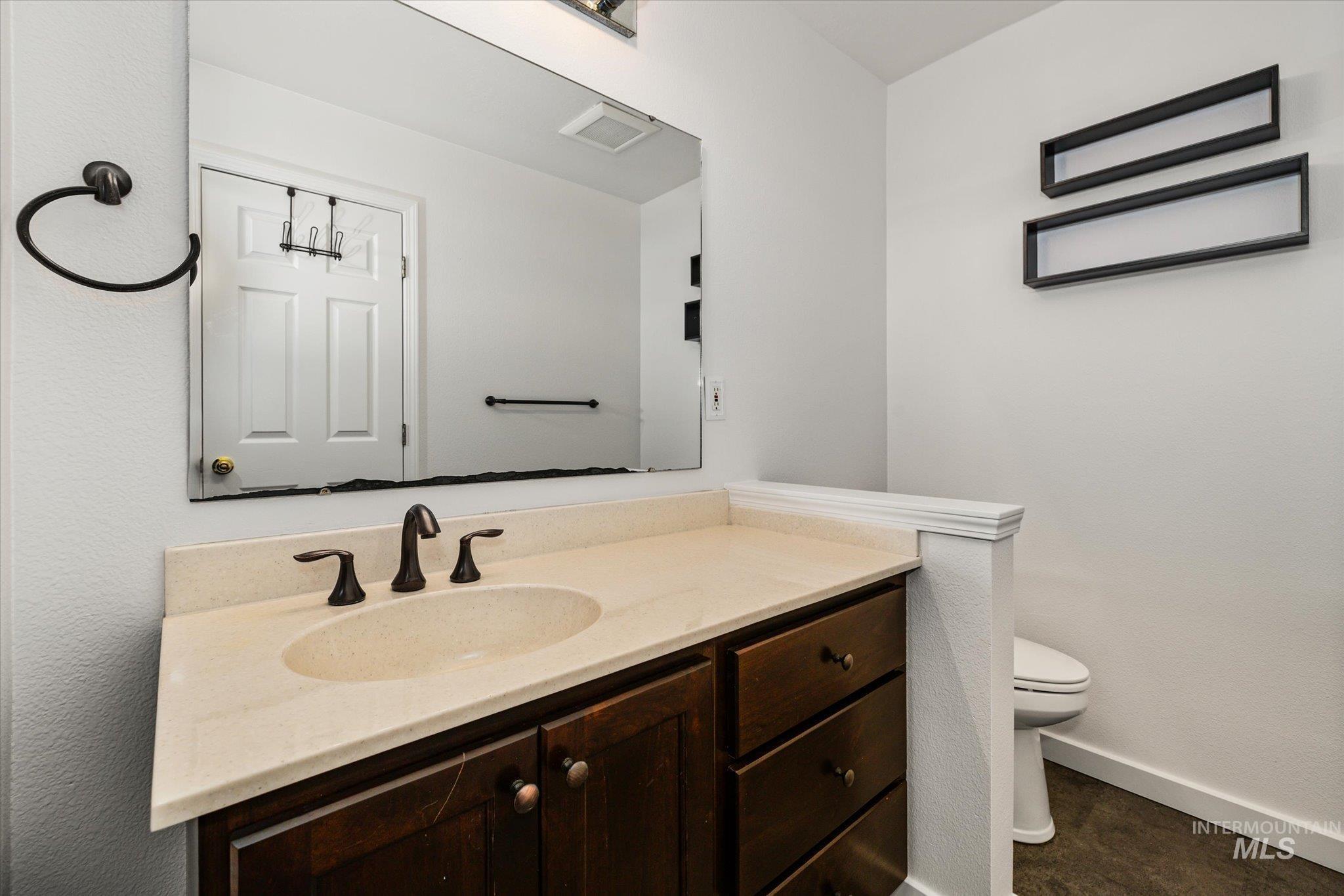 Bathroom with vanity and toilet