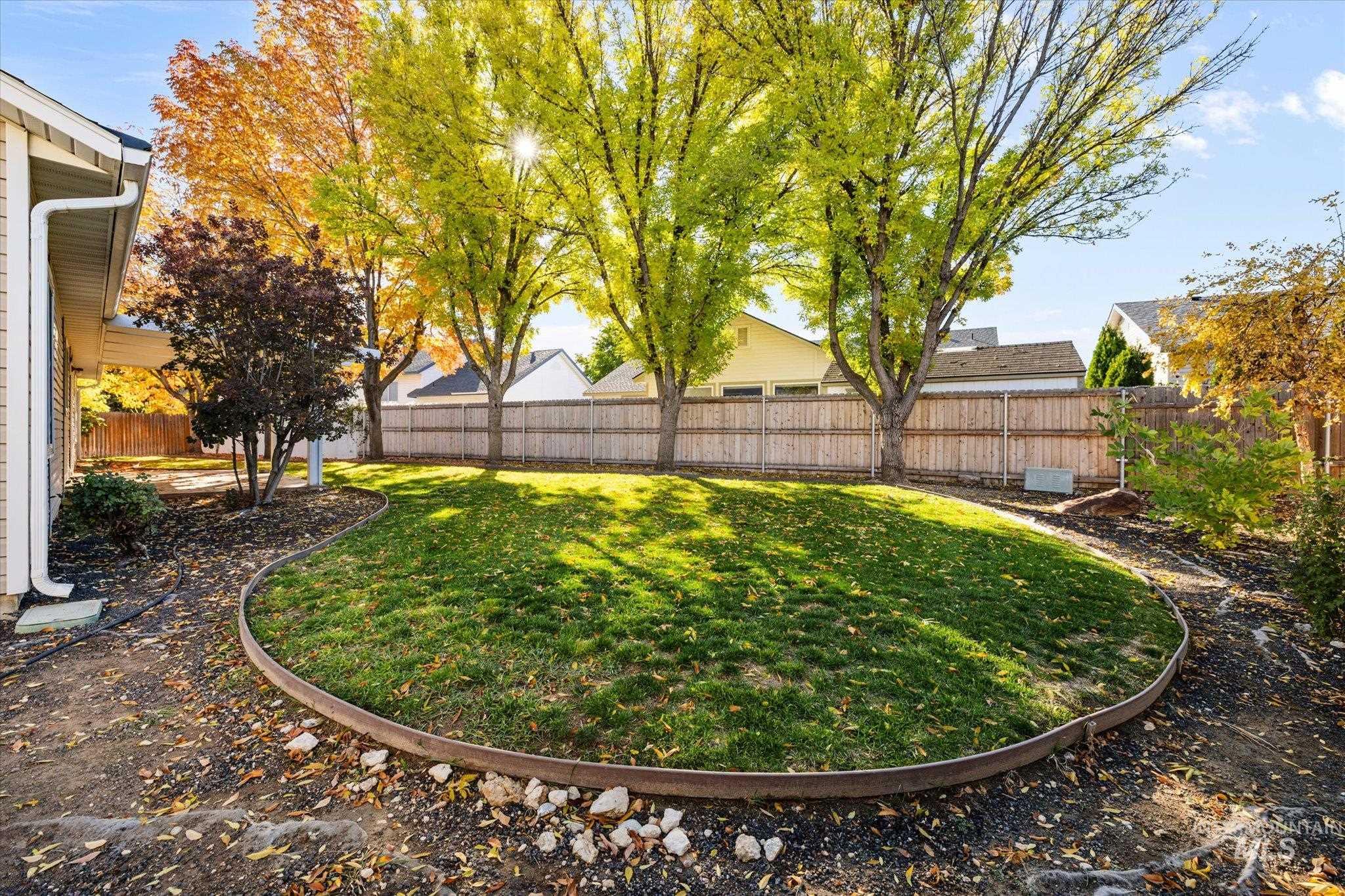 View of fenced backyard