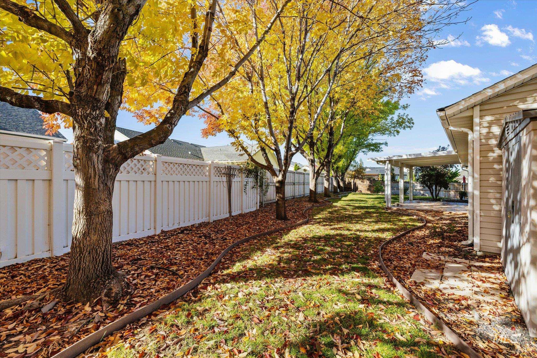 Fenced backyard with a patio area