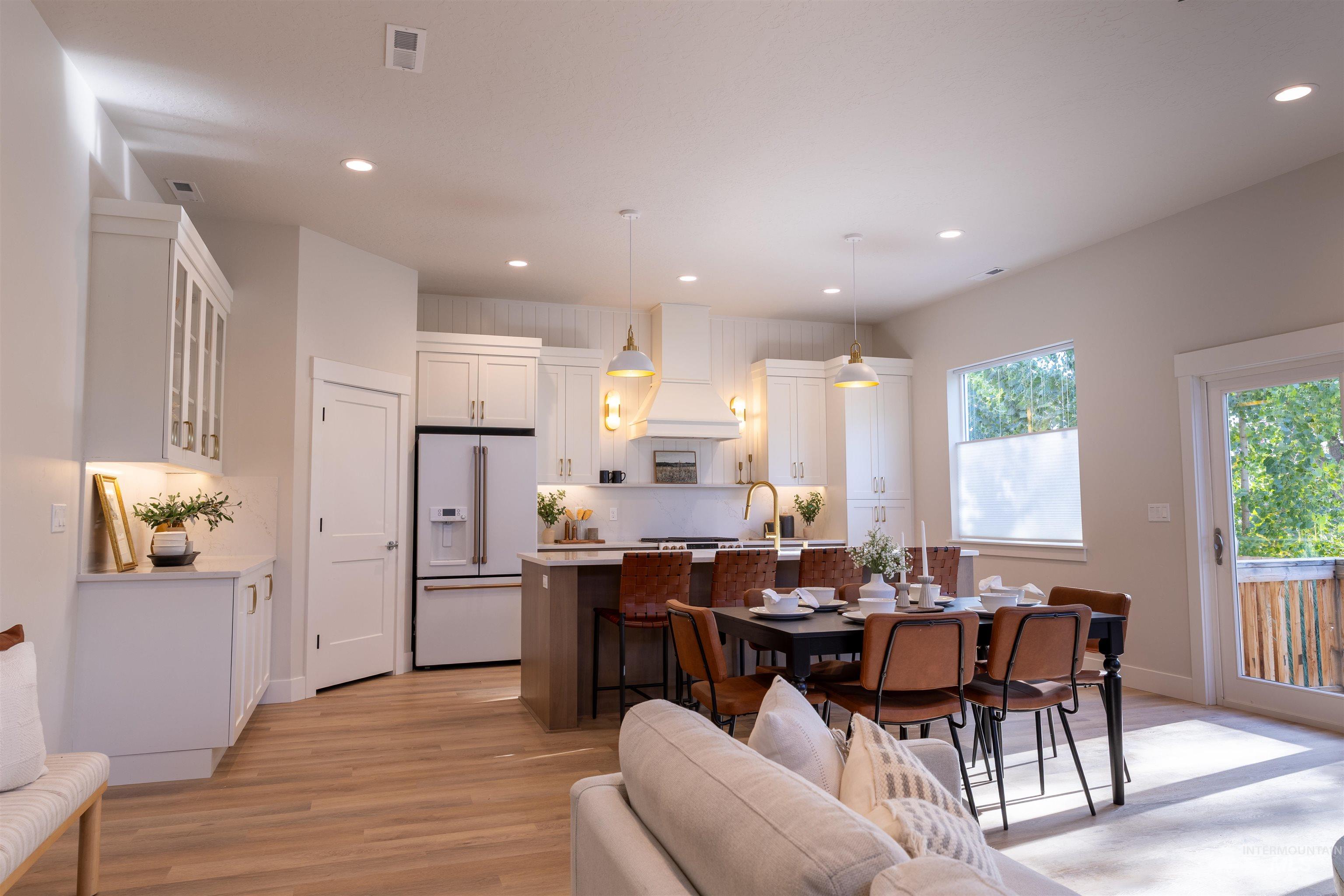 Dining space featuring light wood-type flooring and recessed lighting