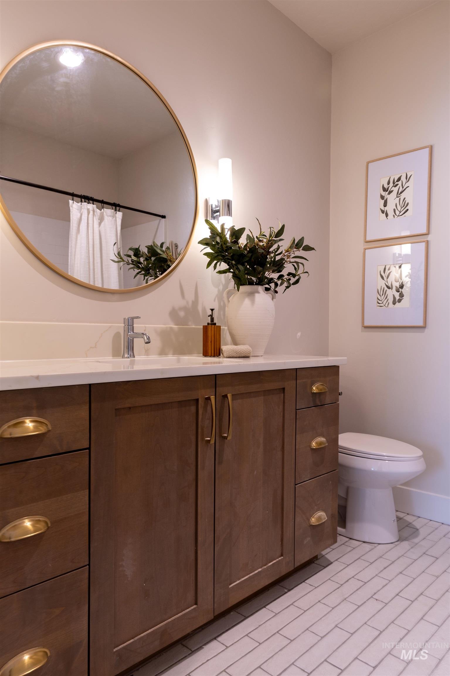 Full bath with vanity and curtained shower