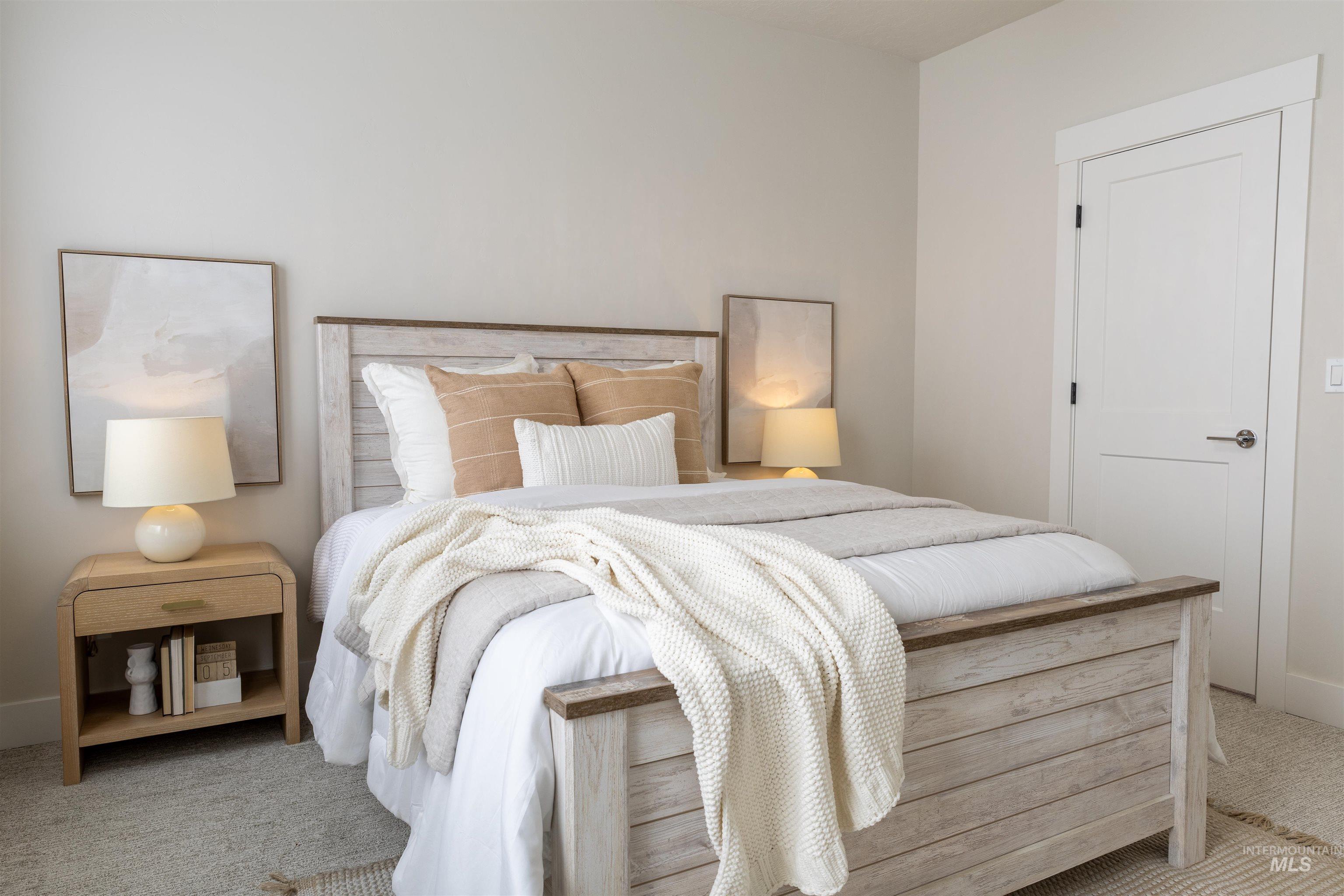 Carpeted bedroom featuring baseboards