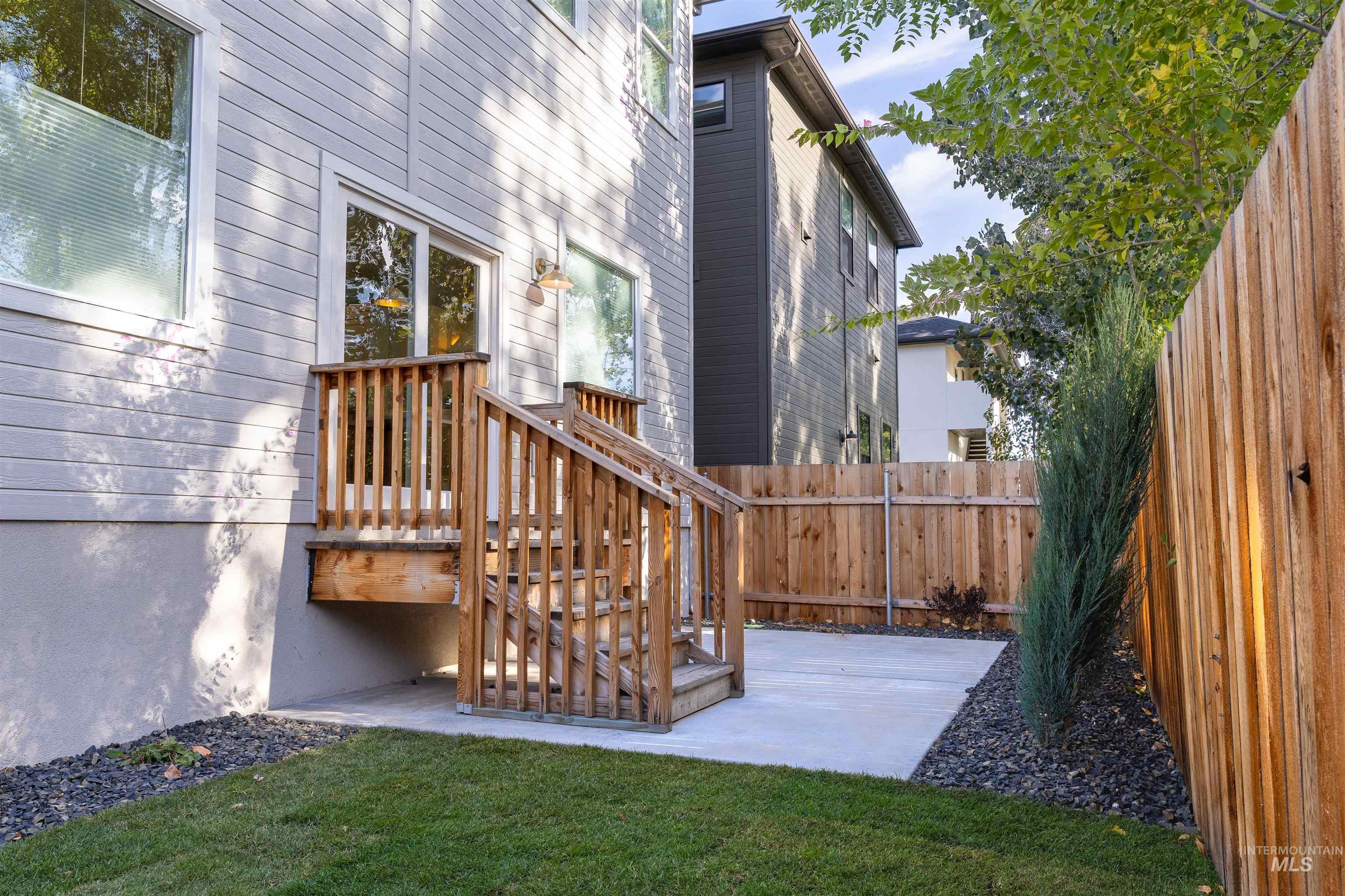 Deck with a fenced backyard and a patio