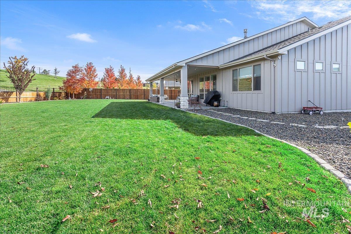 Fenced backyard with a patio area