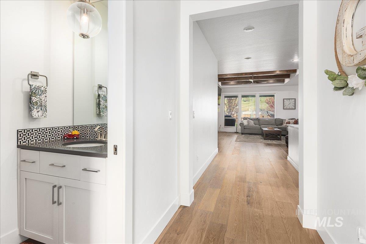 Hallway featuring light wood-style flooring and recessed lighting