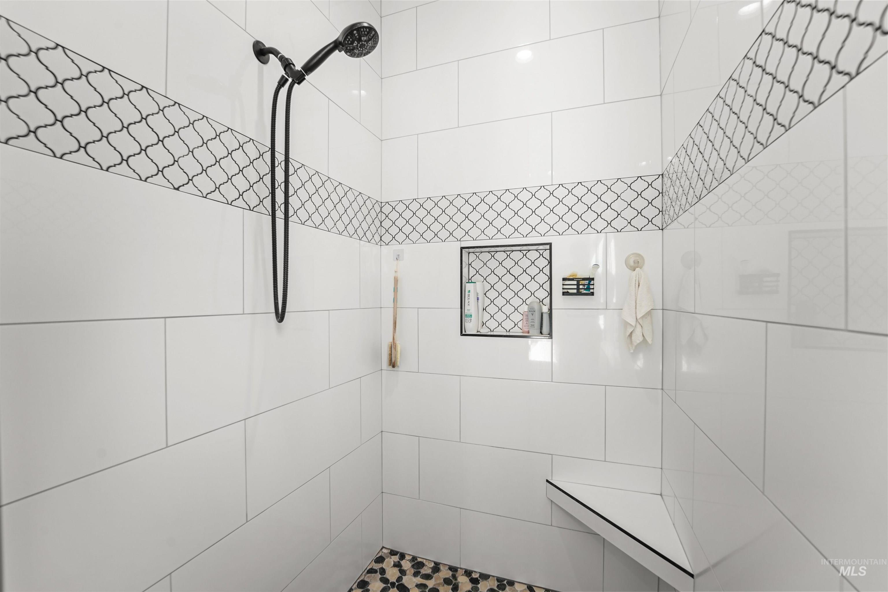 Full bathroom with tiled shower