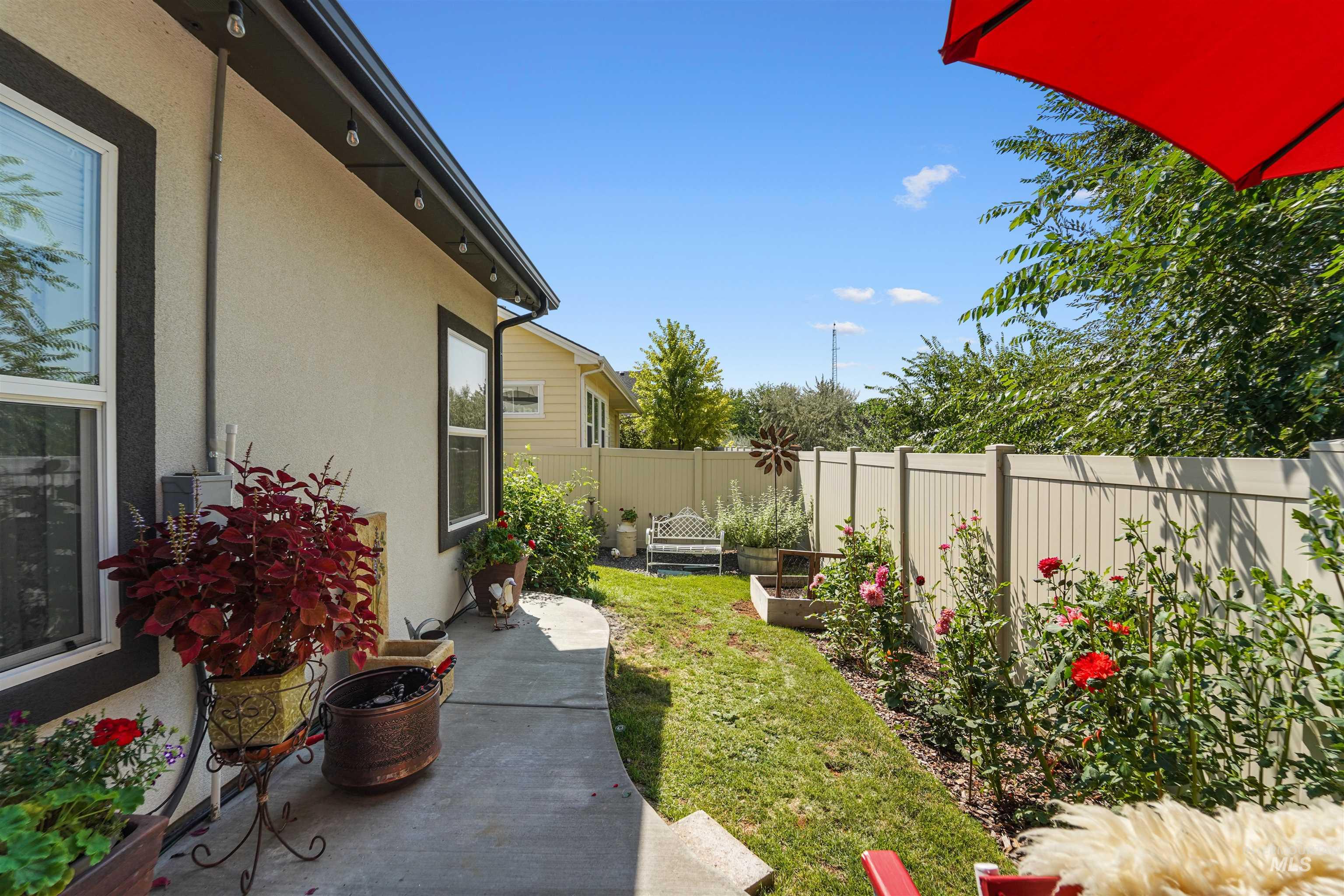 Fenced backyard with a patio