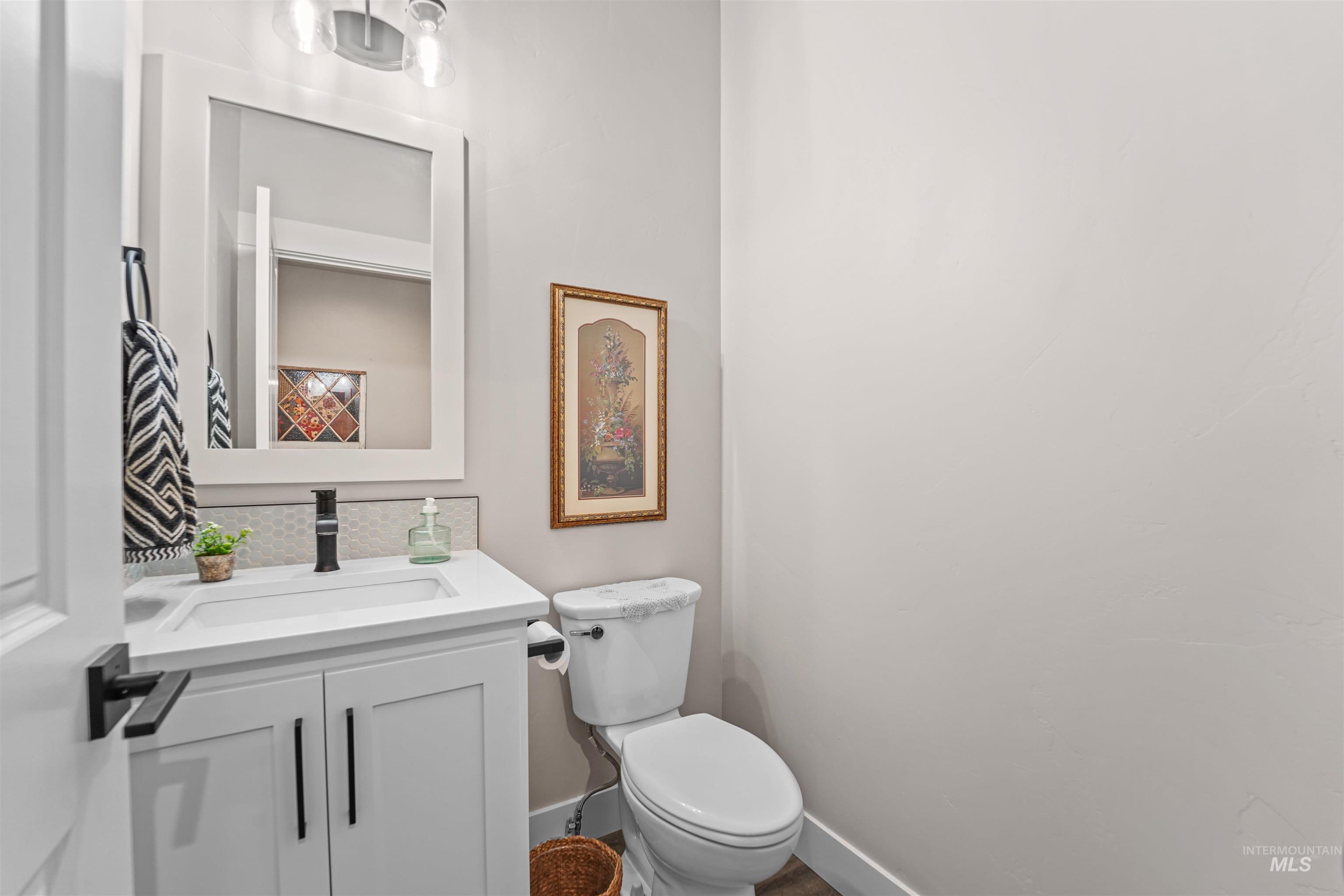 Bathroom featuring vanity and toilet