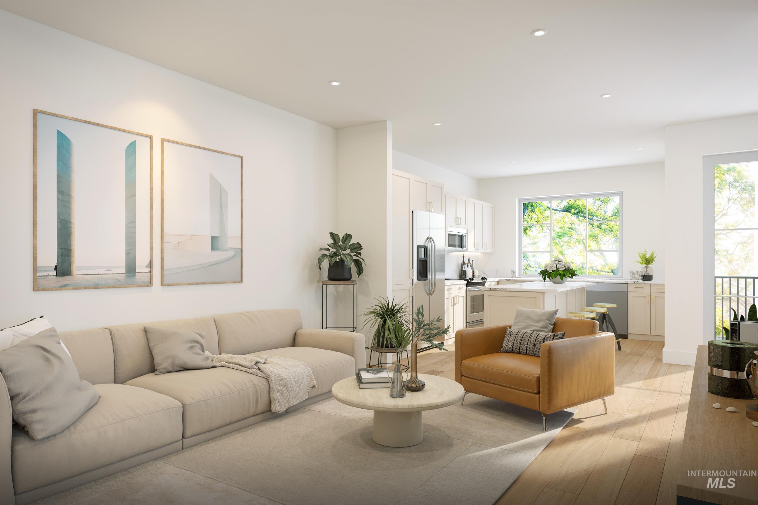 Living area with light wood-type flooring and recessed lighting