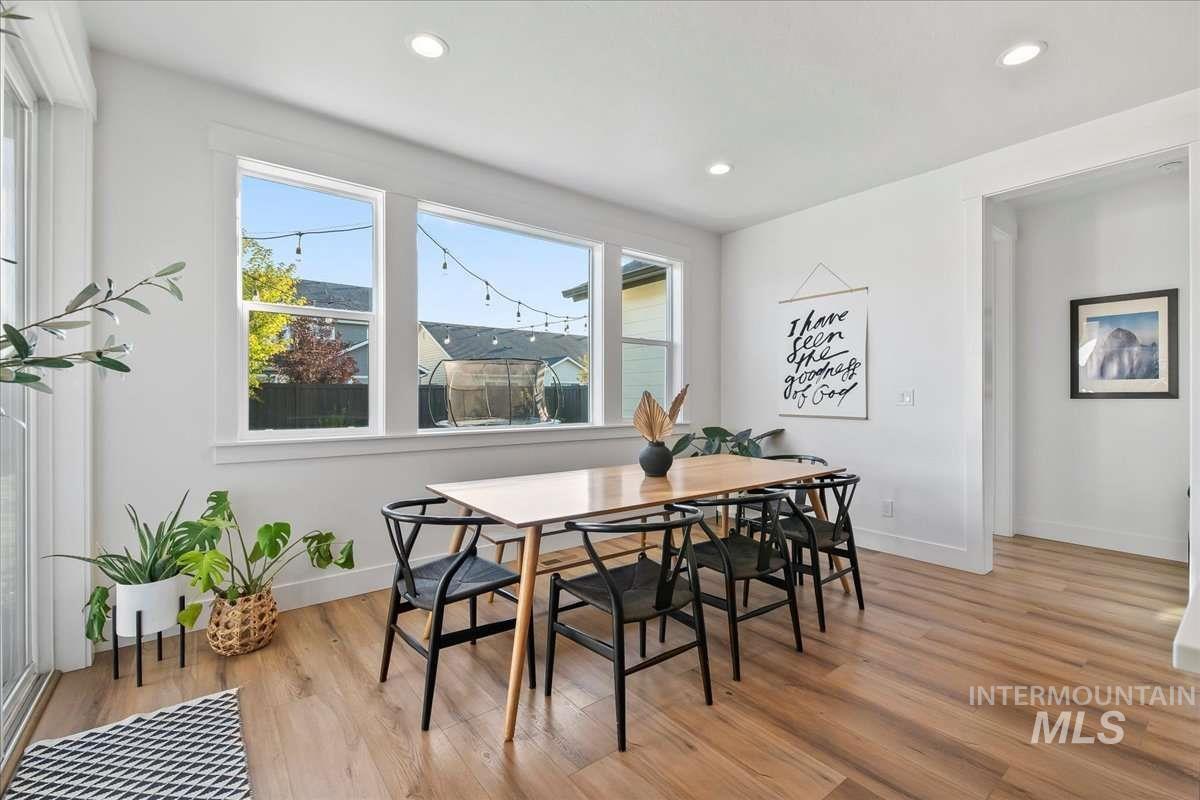 Dining room featuring light wood-style flooring and recessed lighting