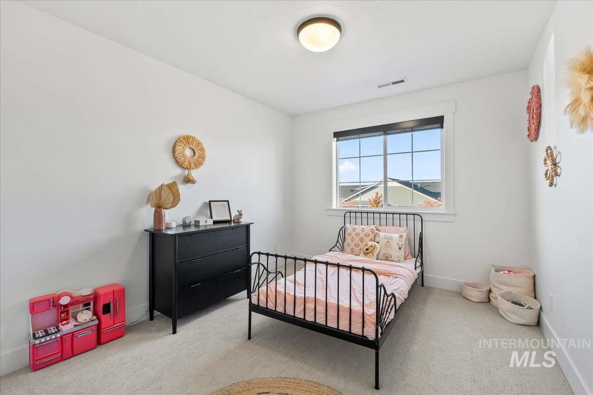 Bedroom with carpet and baseboards
