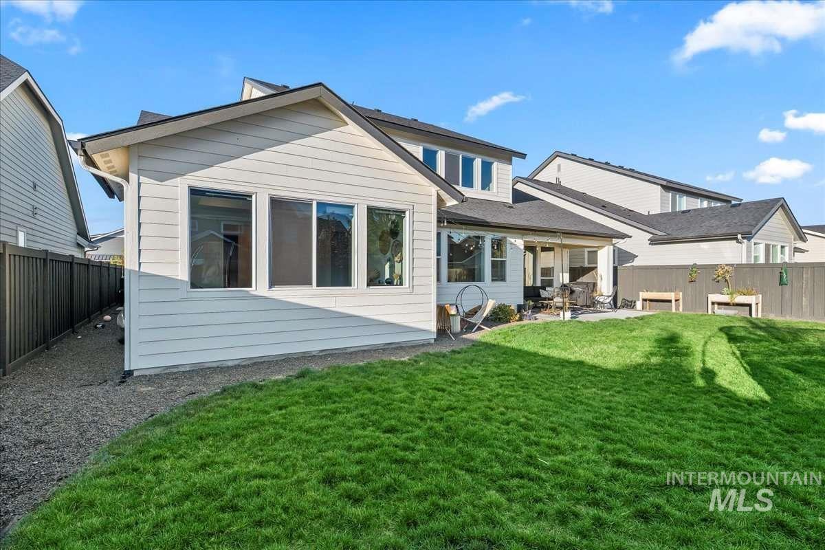 Back of house featuring a fenced backyard and a patio